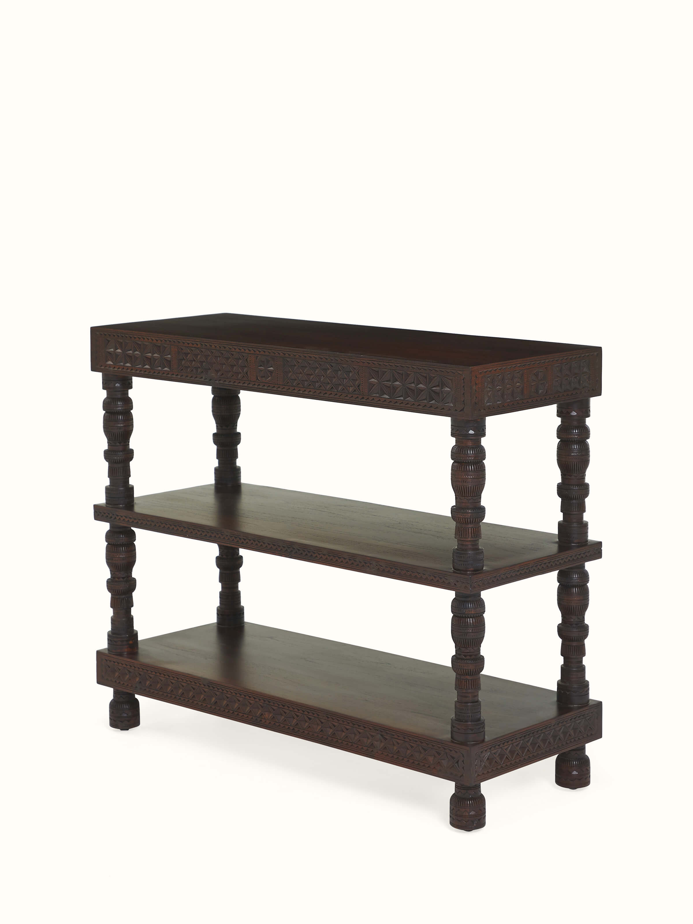 Angled view of carved patterns and wood finish – handmade Swadesh furniture