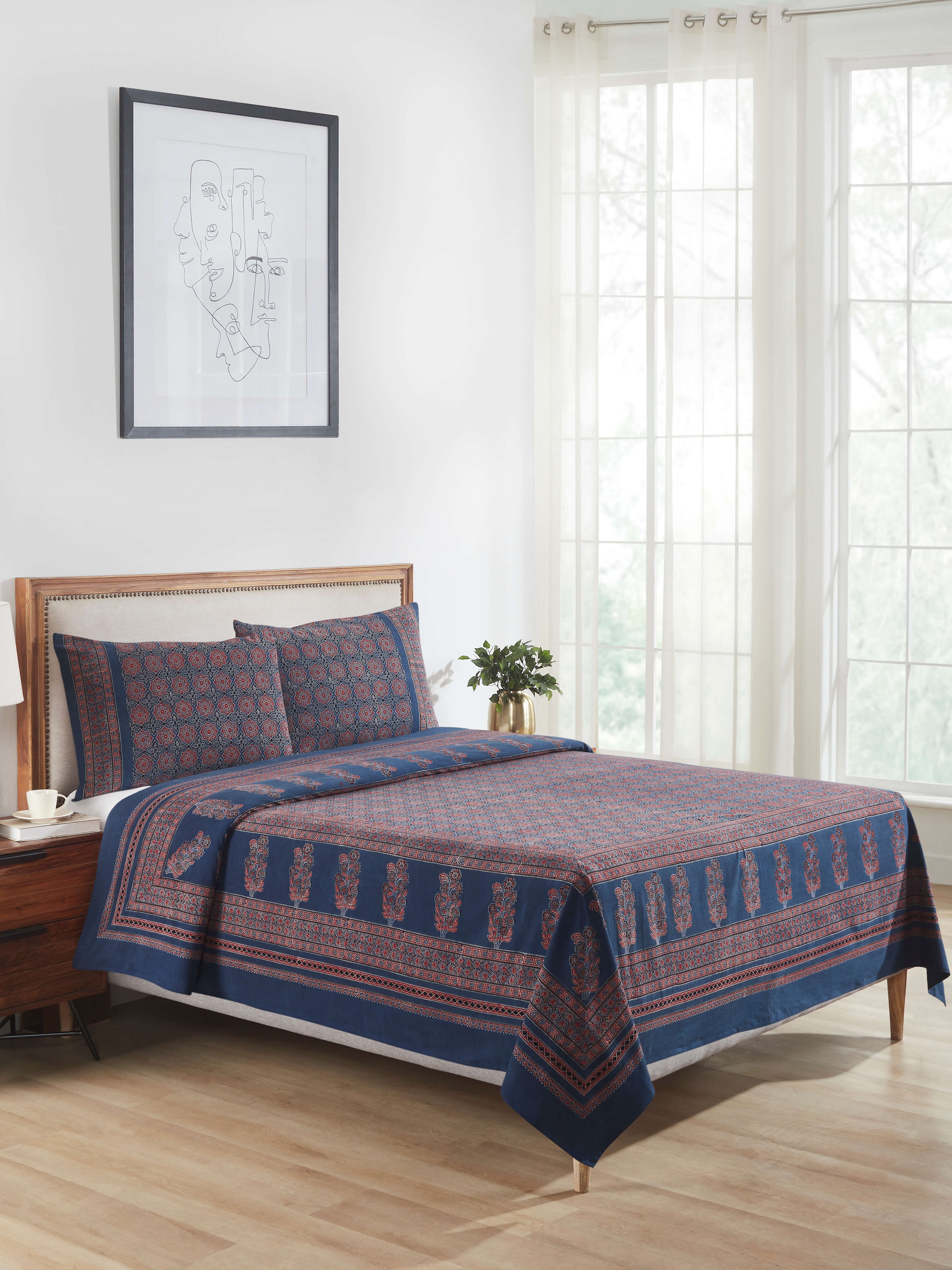 Side view of Sindh blue jaal cotton ajrakh block printed king bedspread set highlighting the fabric's texture and print