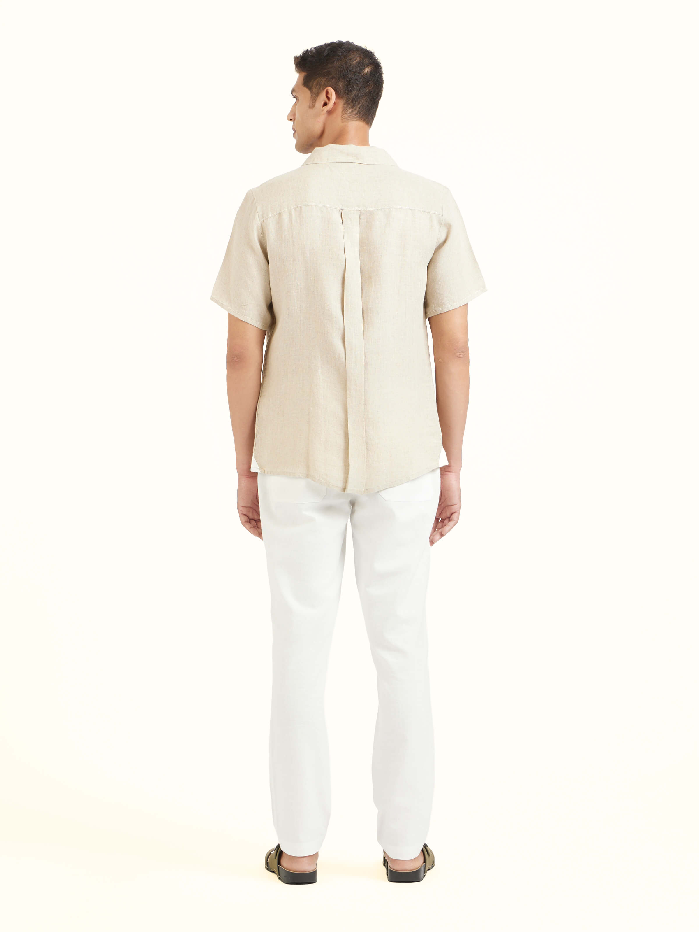 Back view of beige Cuban collar linen shirt displaying neat finish