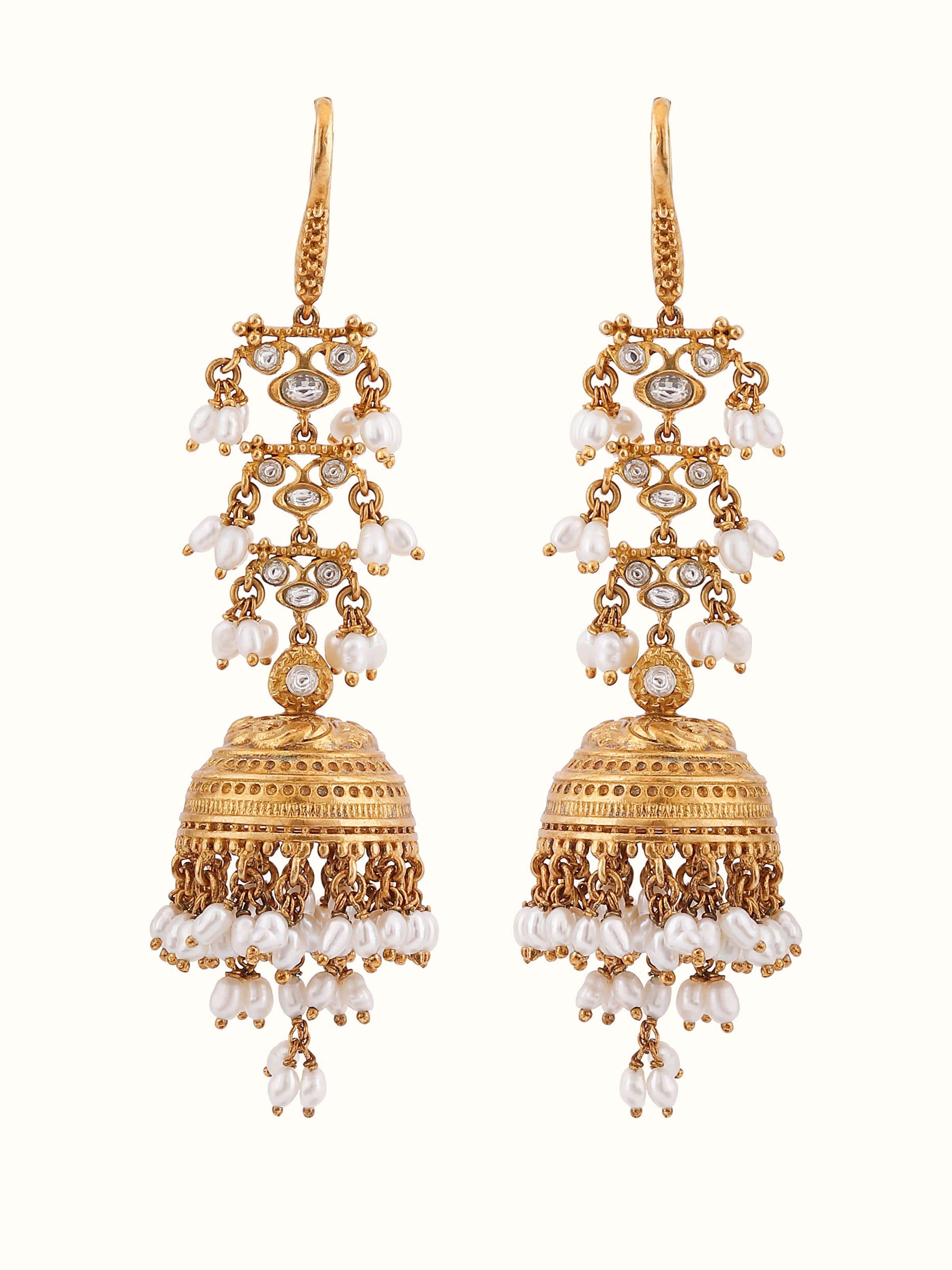 Front view of Guttapusalu silver jhumkas adorned with pearl clusters and temple-style design.