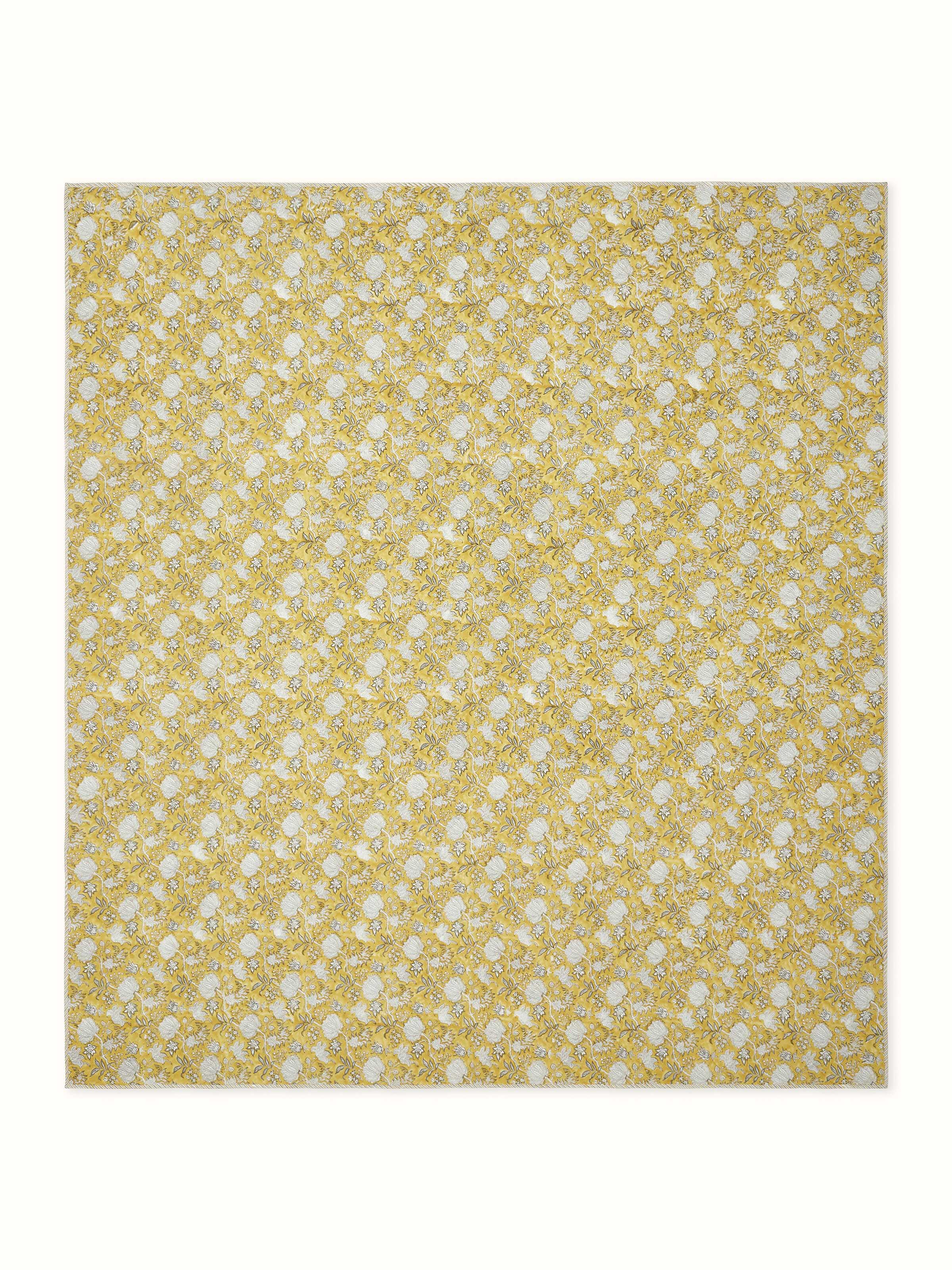 Front view of Kairavam Yellow Floral Cotton Sanganeri Quilted Bedspread with matching pillows, made from breathable cotton by Swadesh