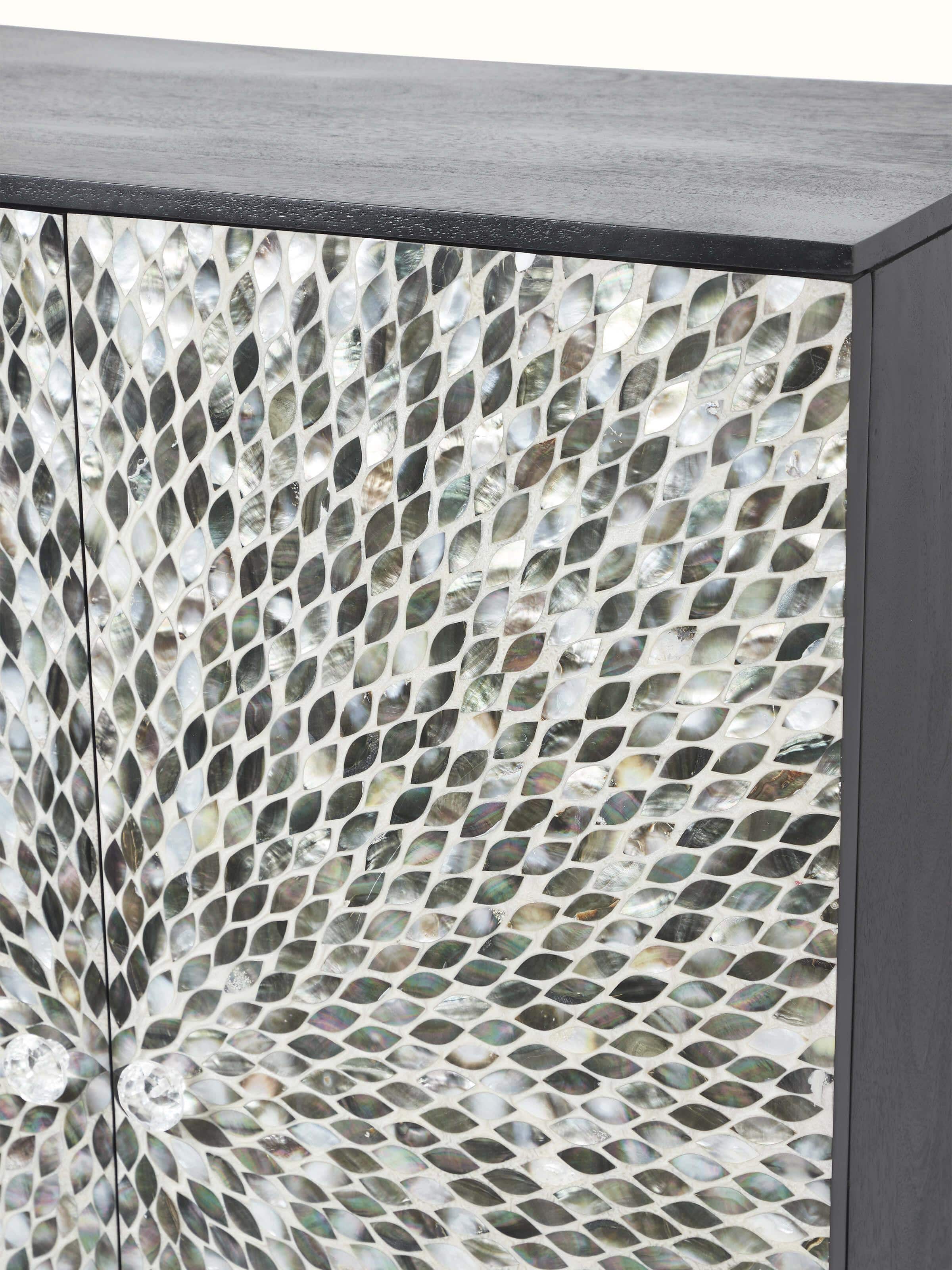 View of the interior of the mango wood bar cabinet with mother-of-pearl inlay, showcasing the storage compartments and design