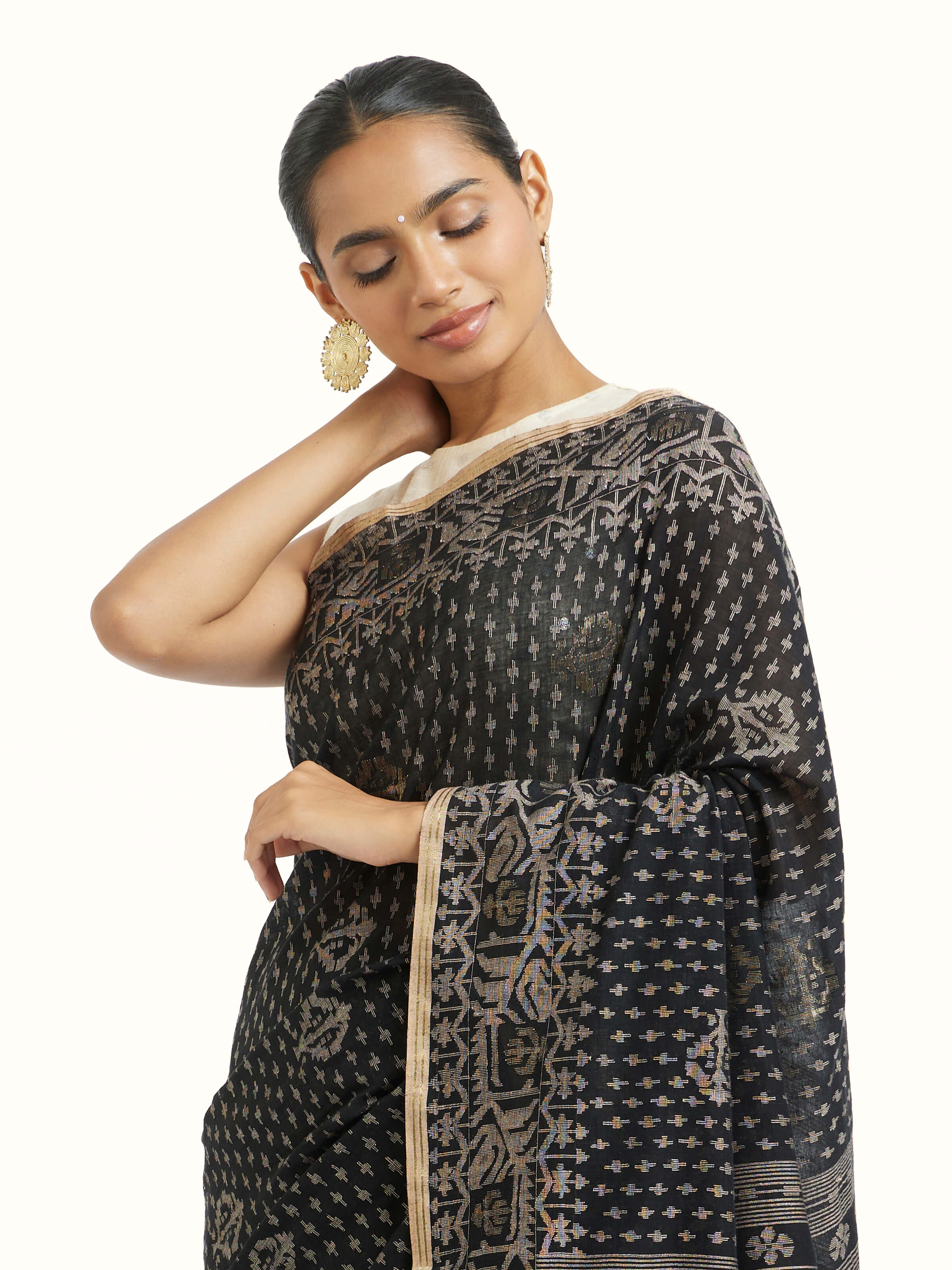 Angled view of black cotton Bengal Jamdani saree highlighting jamdani patterns