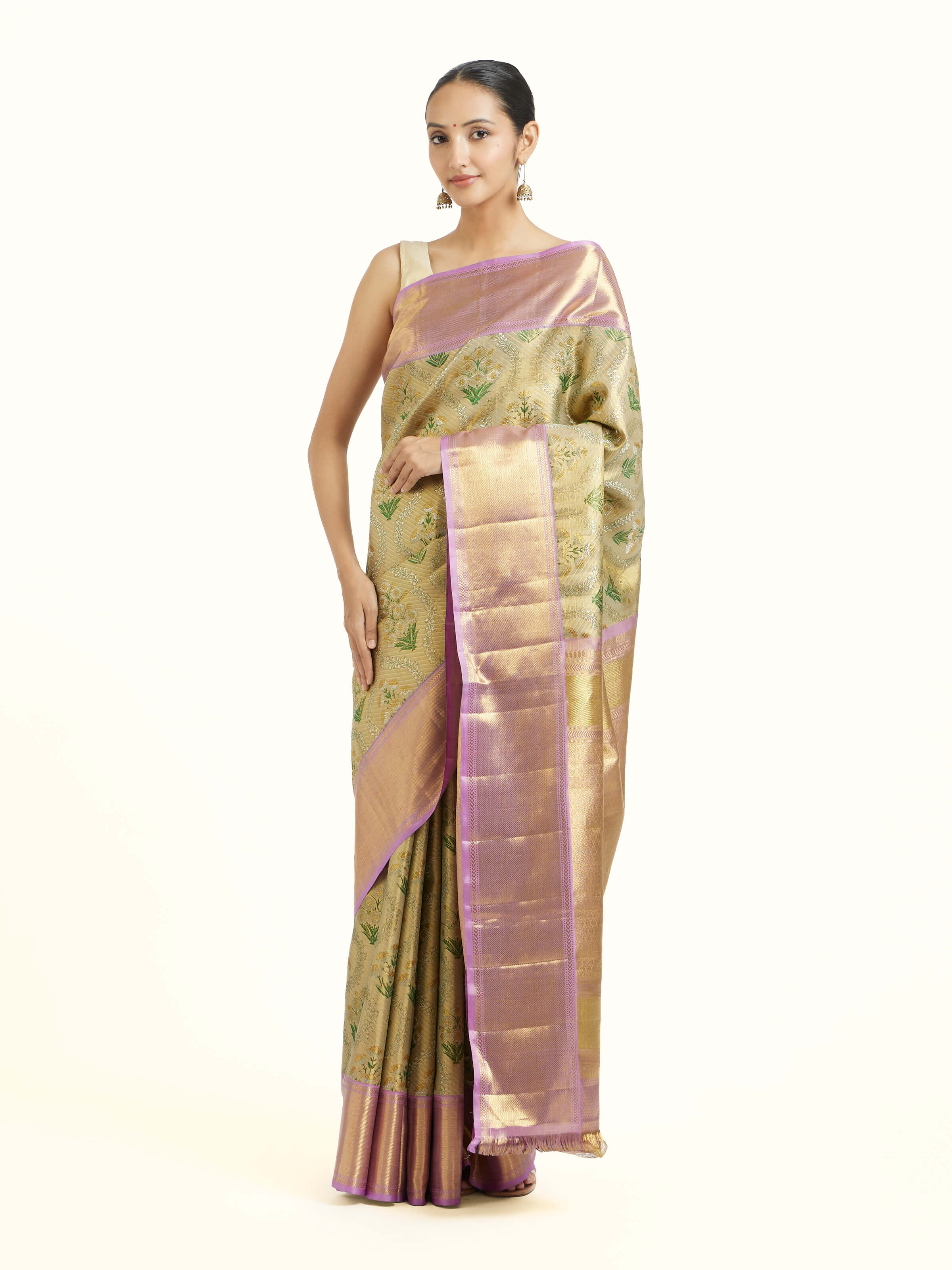 Front view of gold silk Kancheepuram saree with rich zari motifs