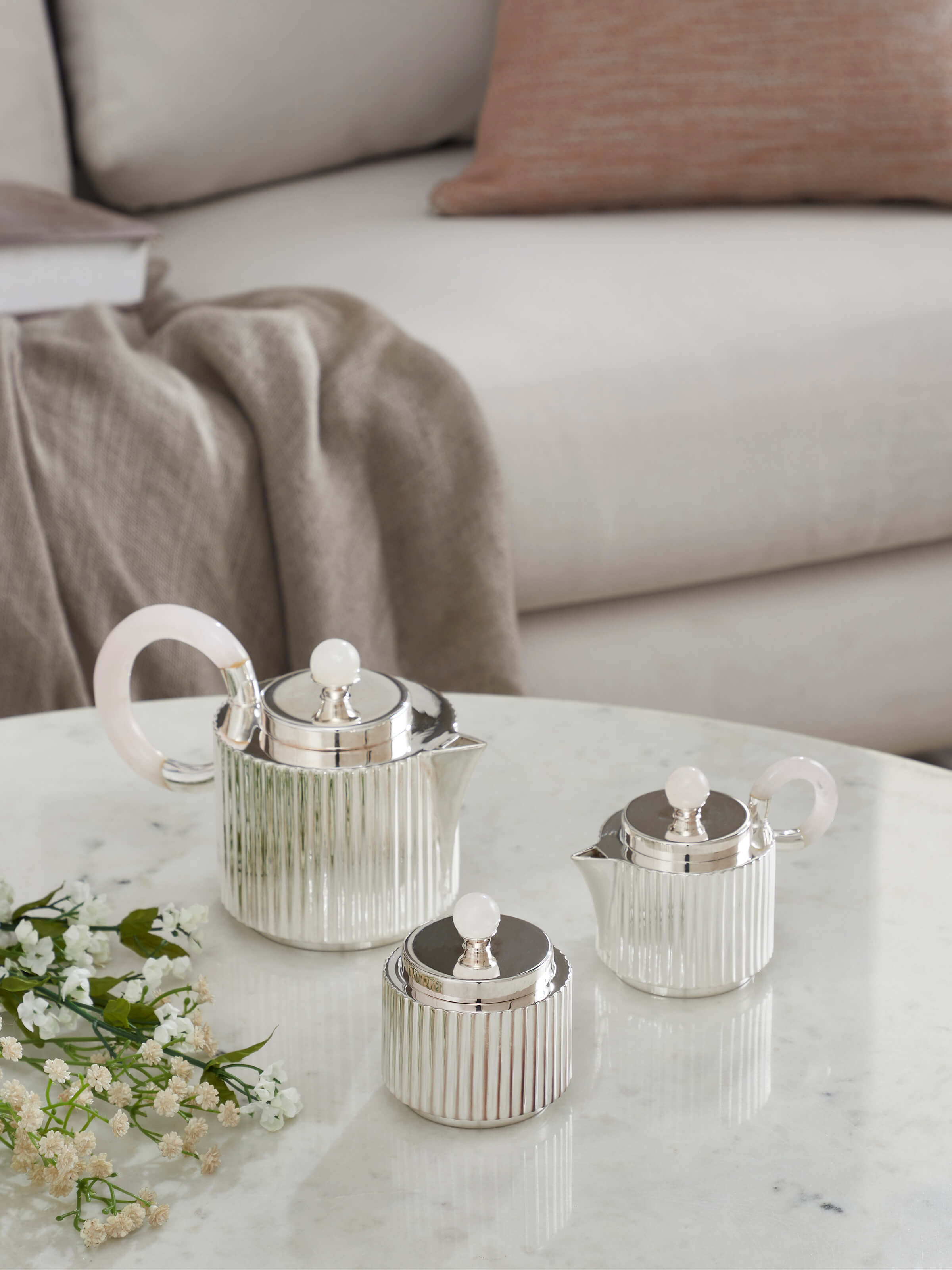 Side view of Silver Water Reed Tea Set (3 Pcs), highlighting the smooth, polished silver surface and detailed design of the tea set.