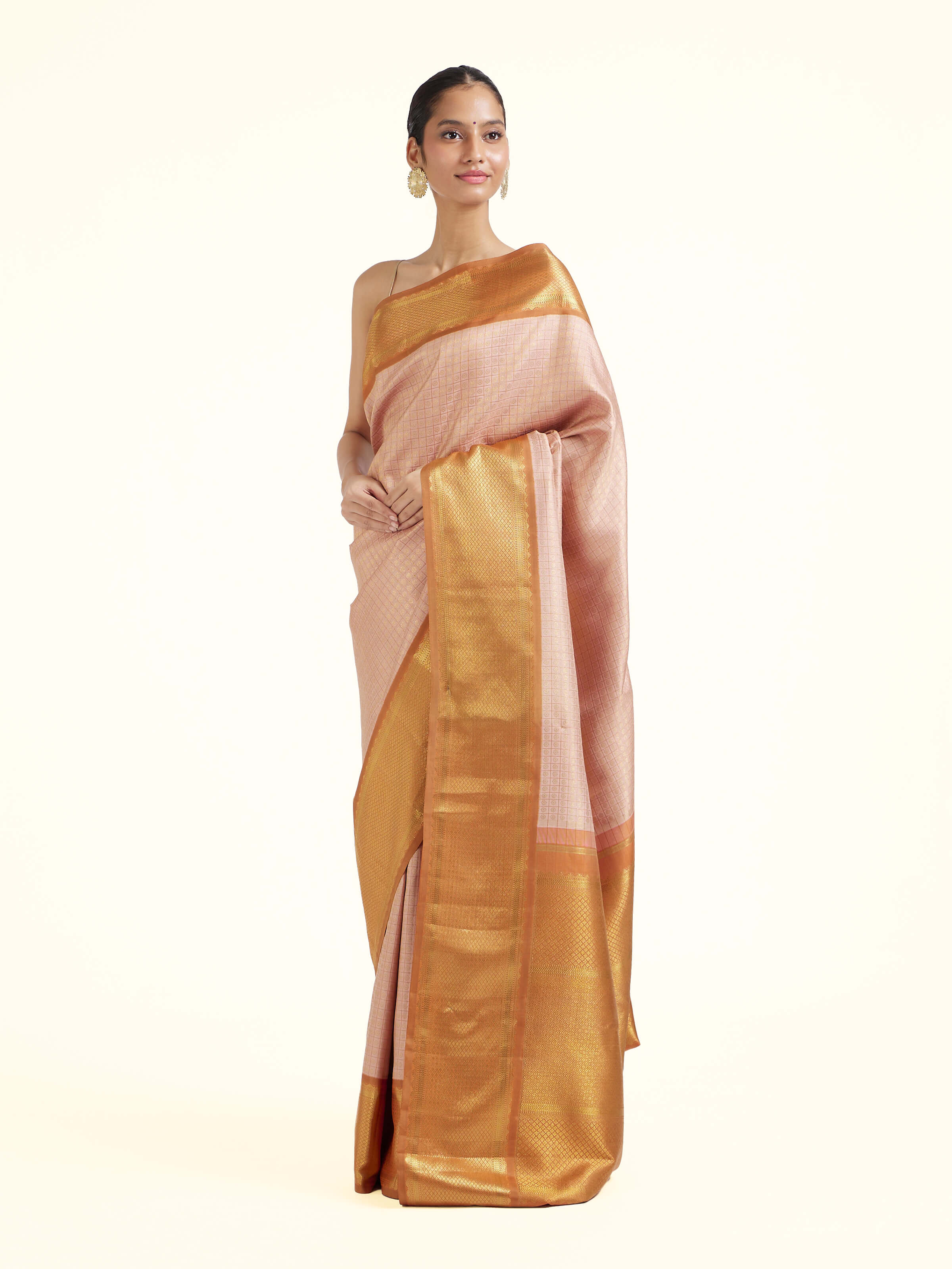 Side view of pink silk Kancheepuram saree with graceful drape and contrast border