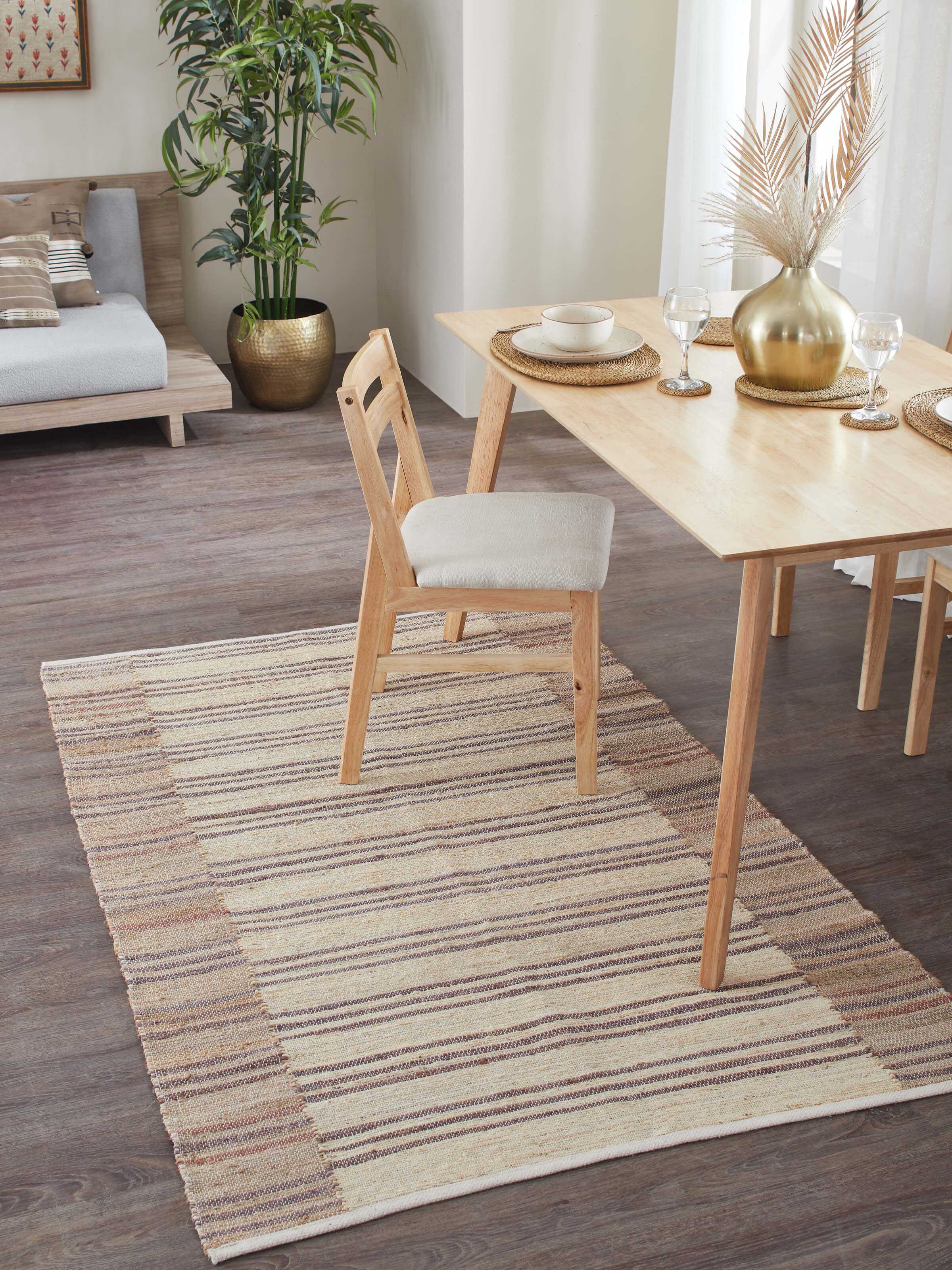Lifestyle image showcasing Textured Stripes Beige Brown Jute Rug in a contemporary room setting