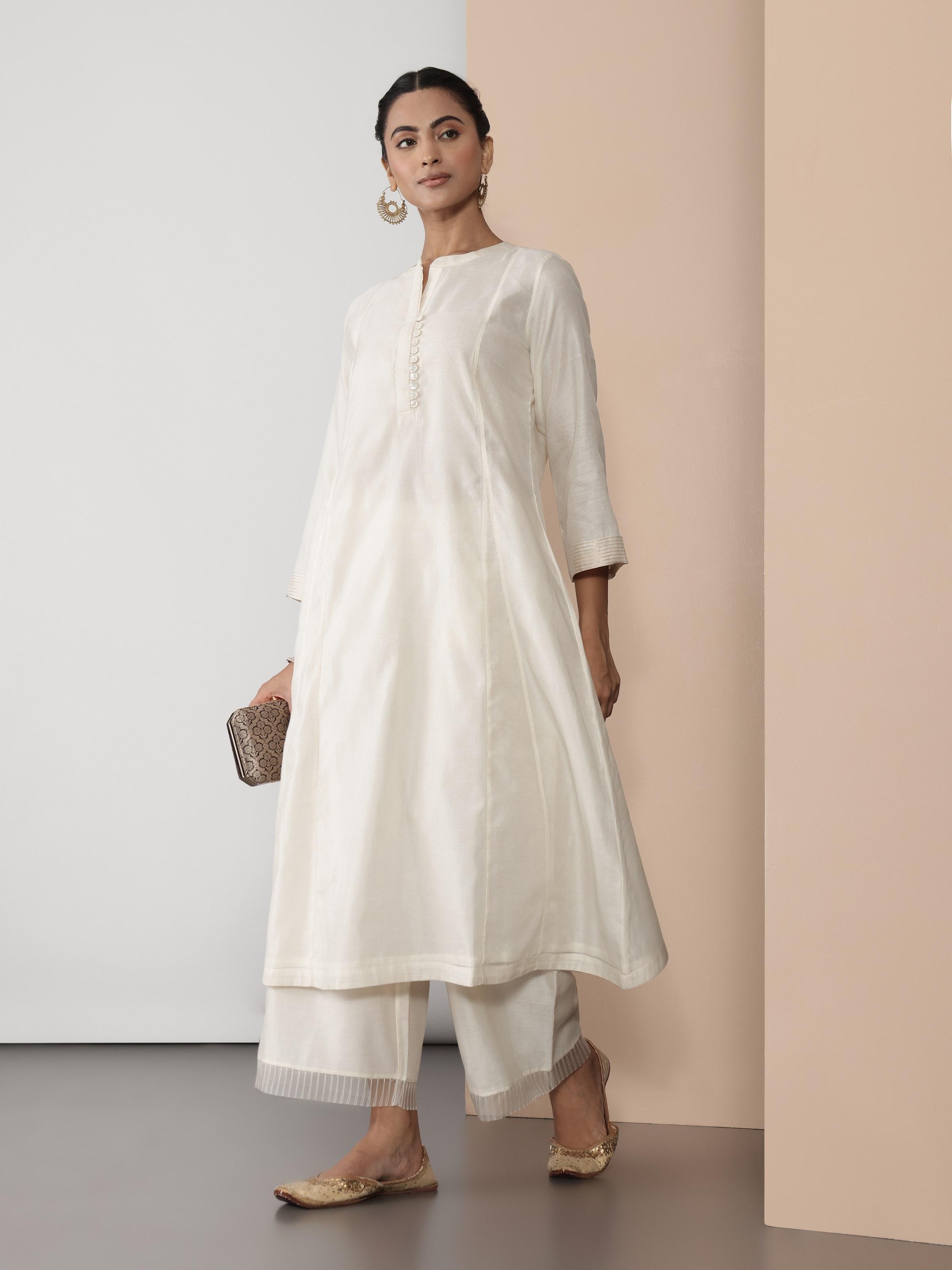 Side lifestyle view highlighting the sheer sleeves and soft drape of the off-white kurta.
