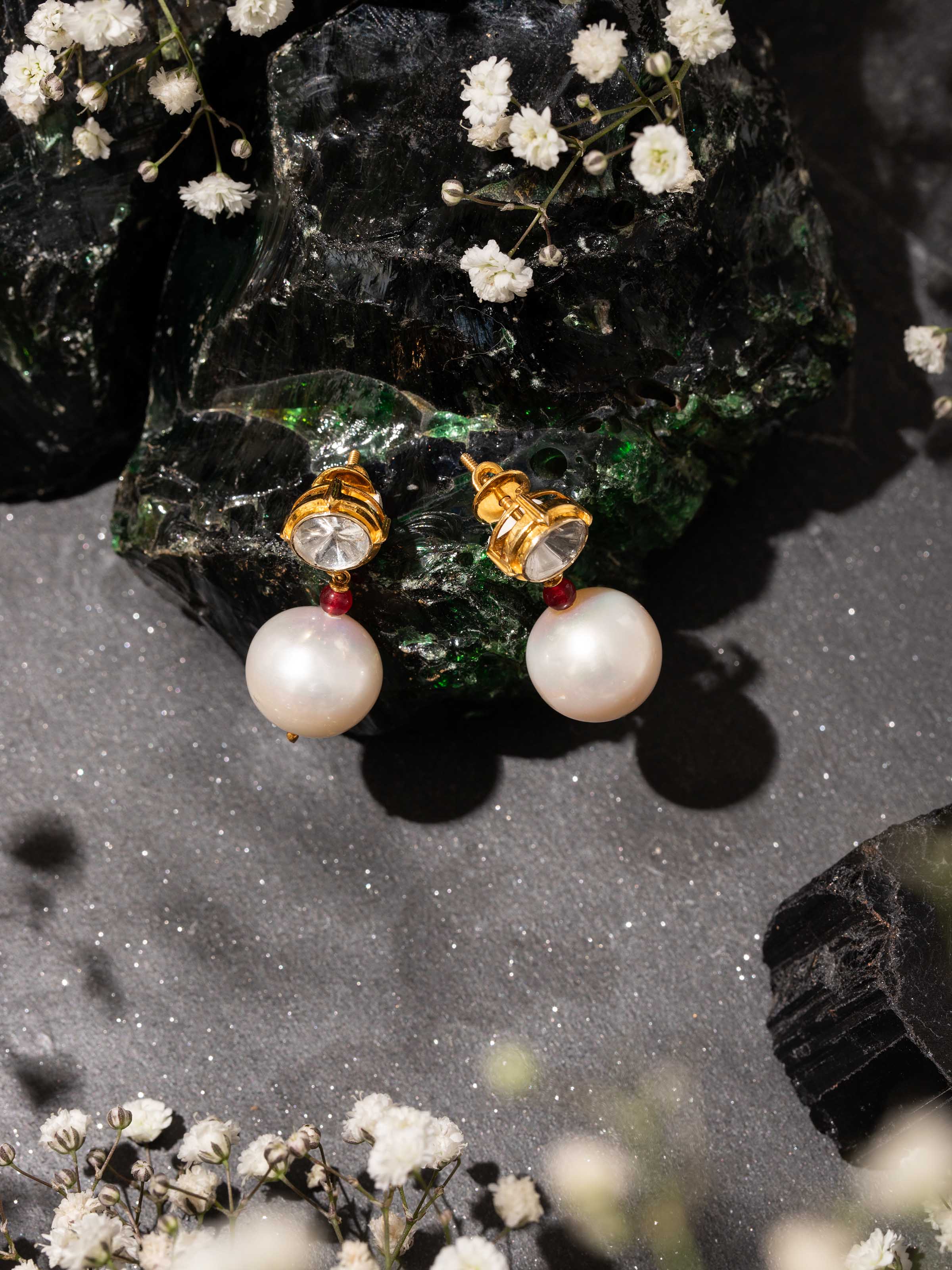 Lifestyle view of Polki gold drop earrings with radiant sparkle and royal elegance