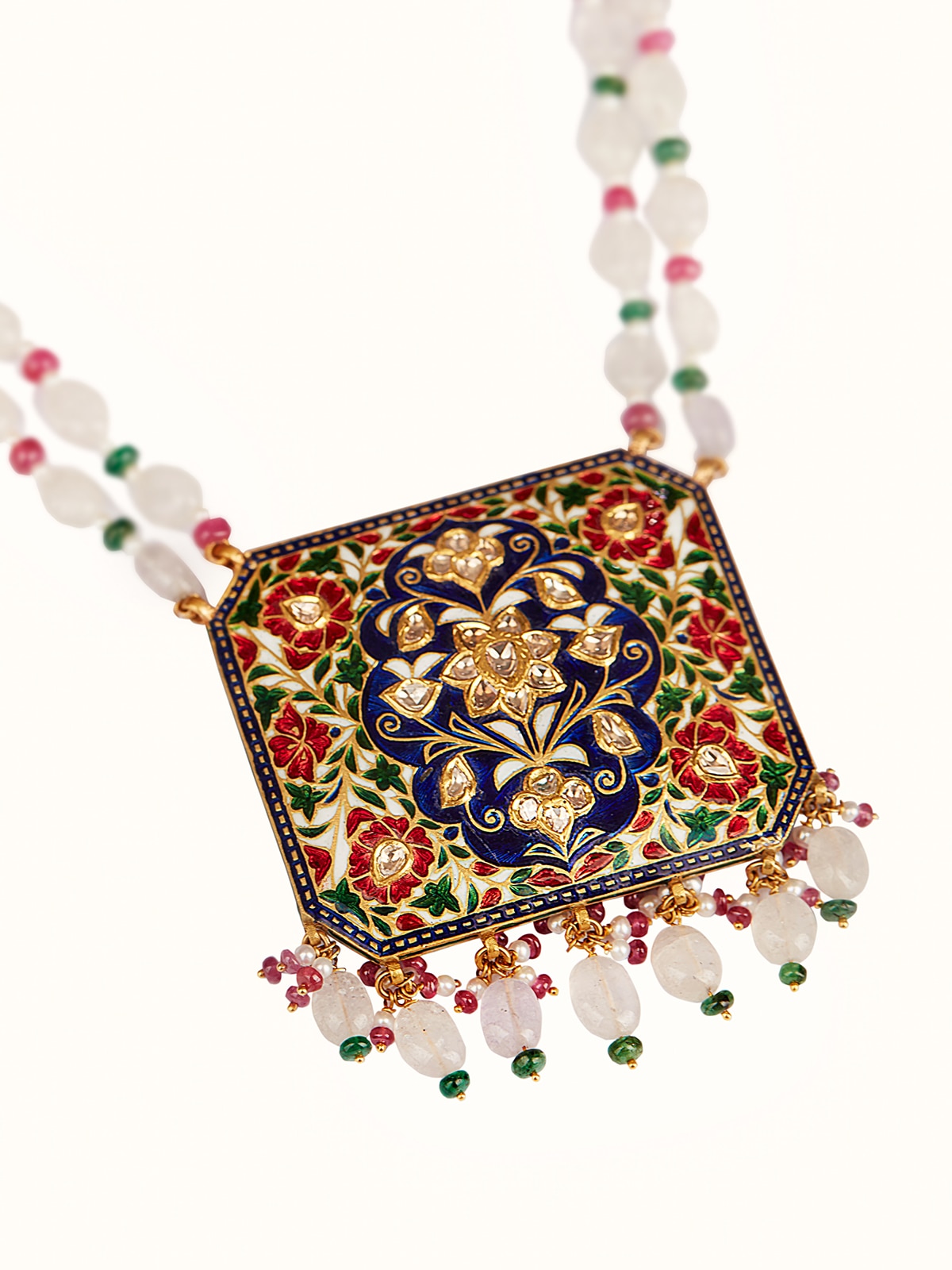 Angled view of Jaipur Meenakari gold pendant highlighting intricate enamel artistry and polished gold surface.