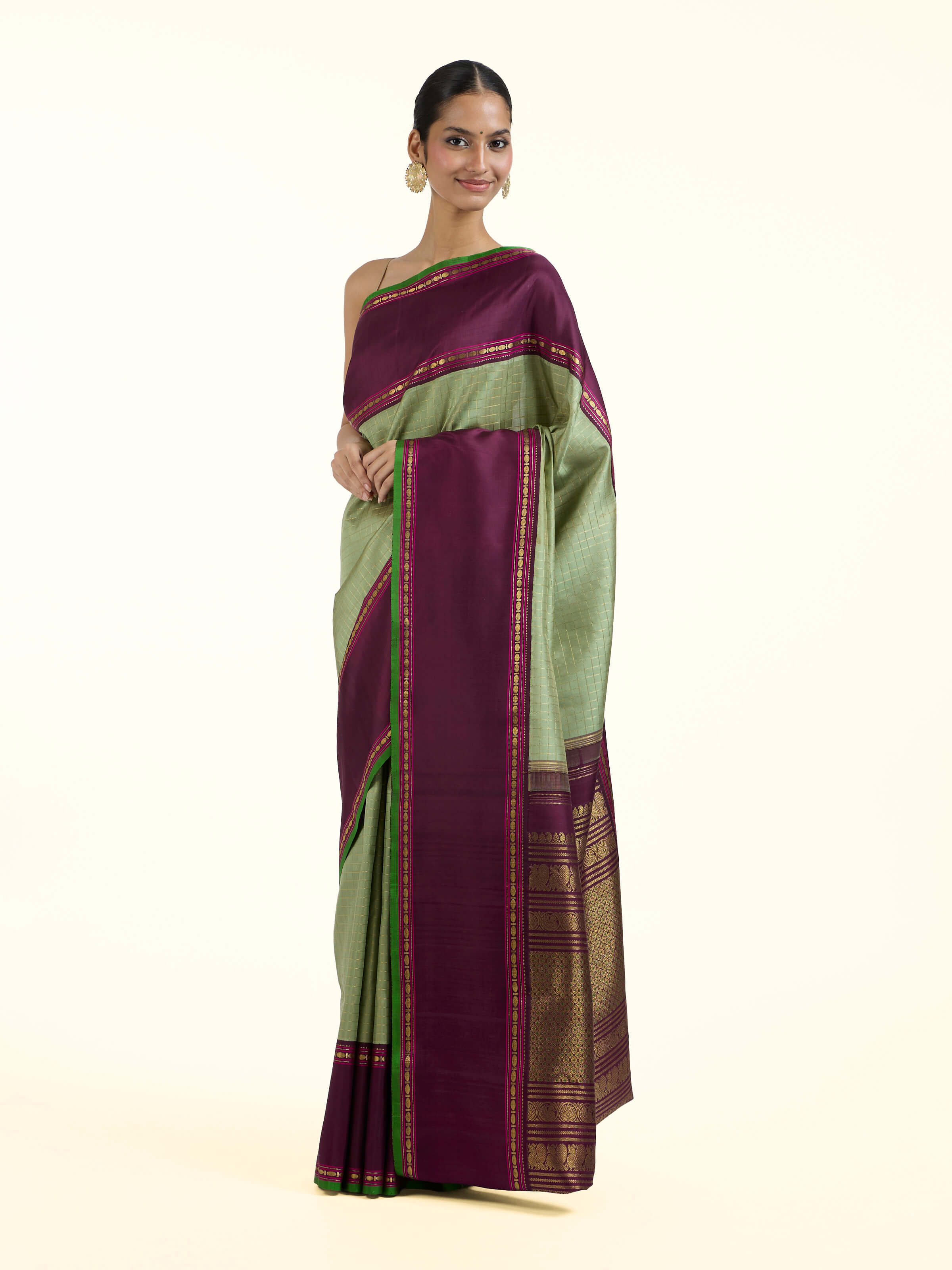 Side view of grey silk Kancheepuram saree with graceful drape and traditional border