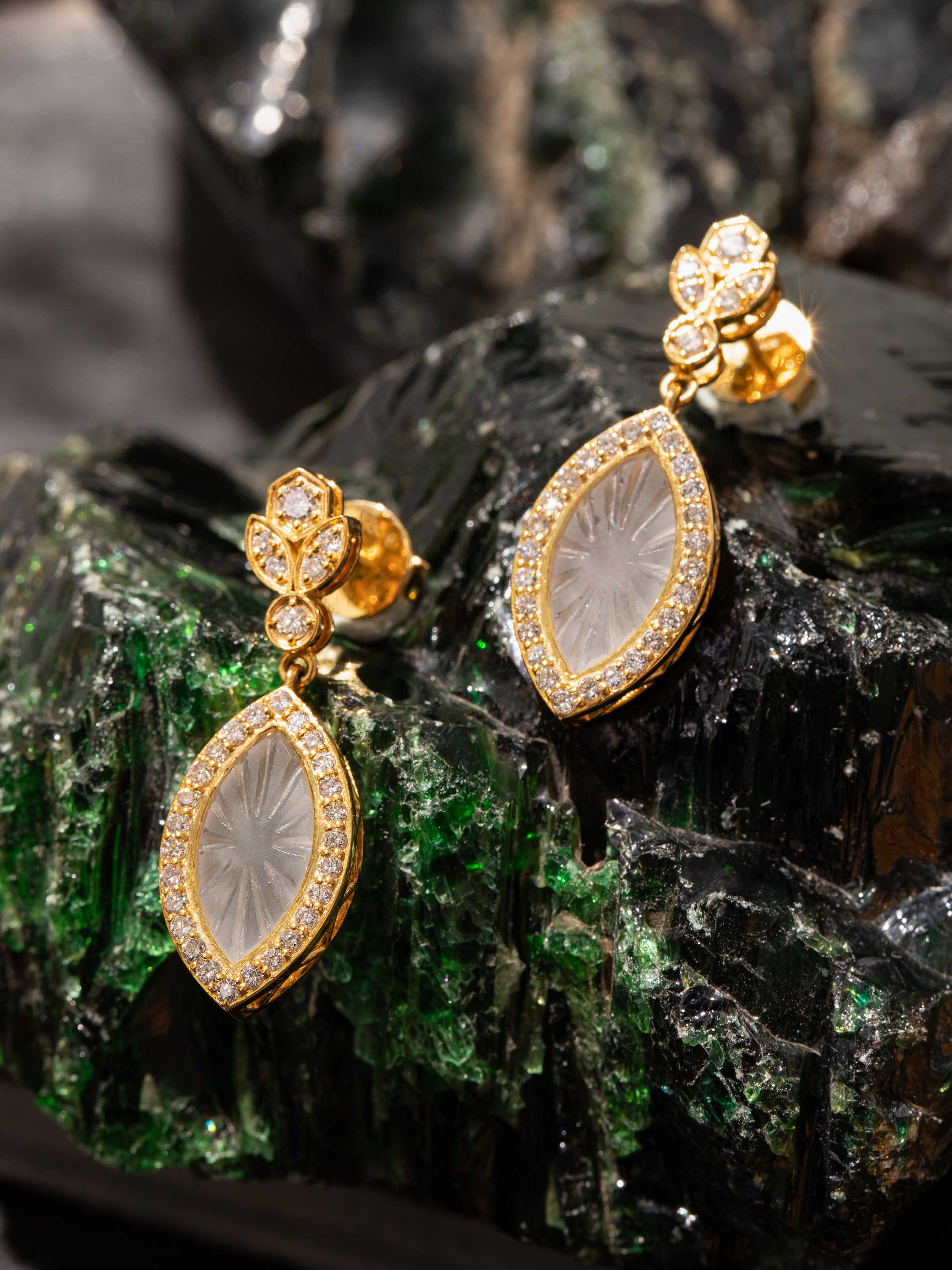 Lifestyle view of lapidary 14 karat gold drop earrings