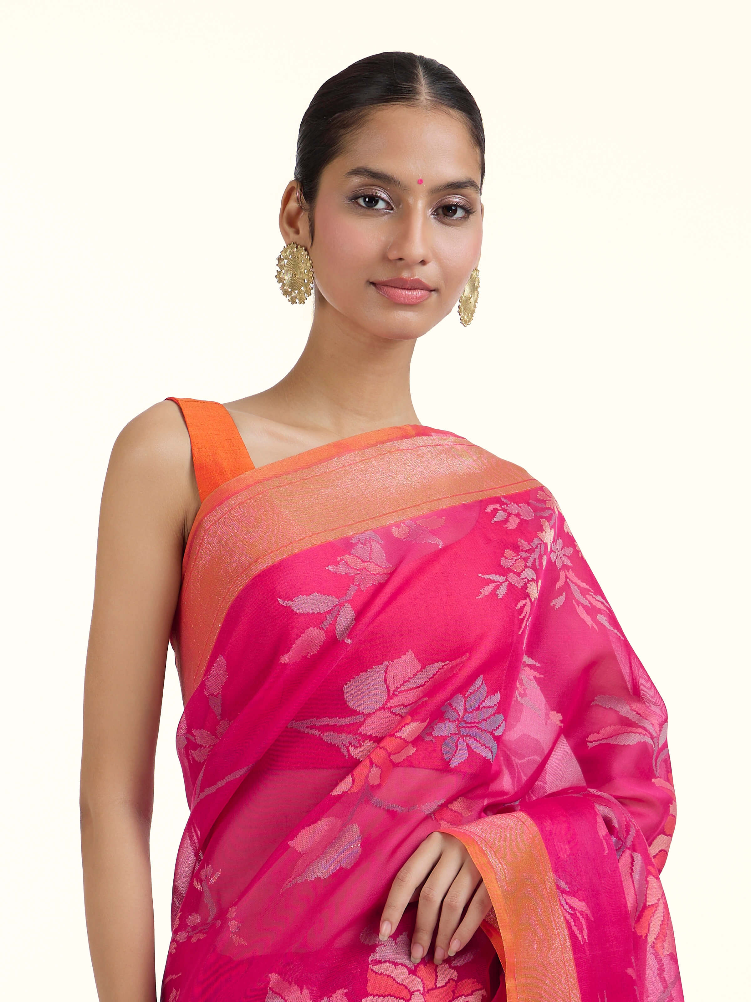 Angled view of pink cotton Awadh Jamdani saree highlighting traditional Jamdani weave
