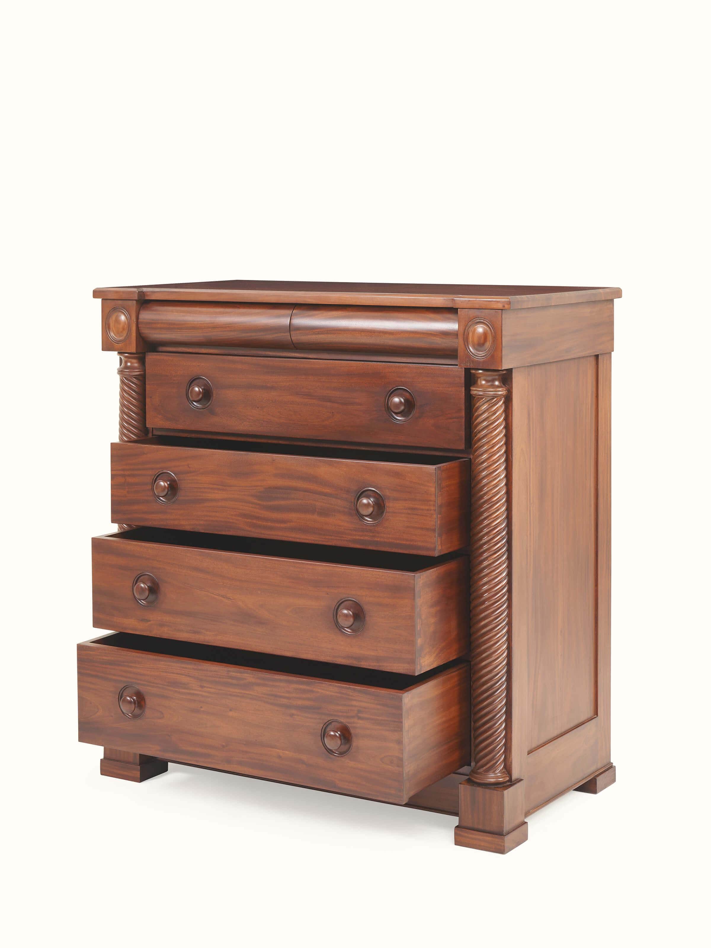 Angle view of Mahogany wood chest of drawer emphasizing beveled edges and drawer handle design