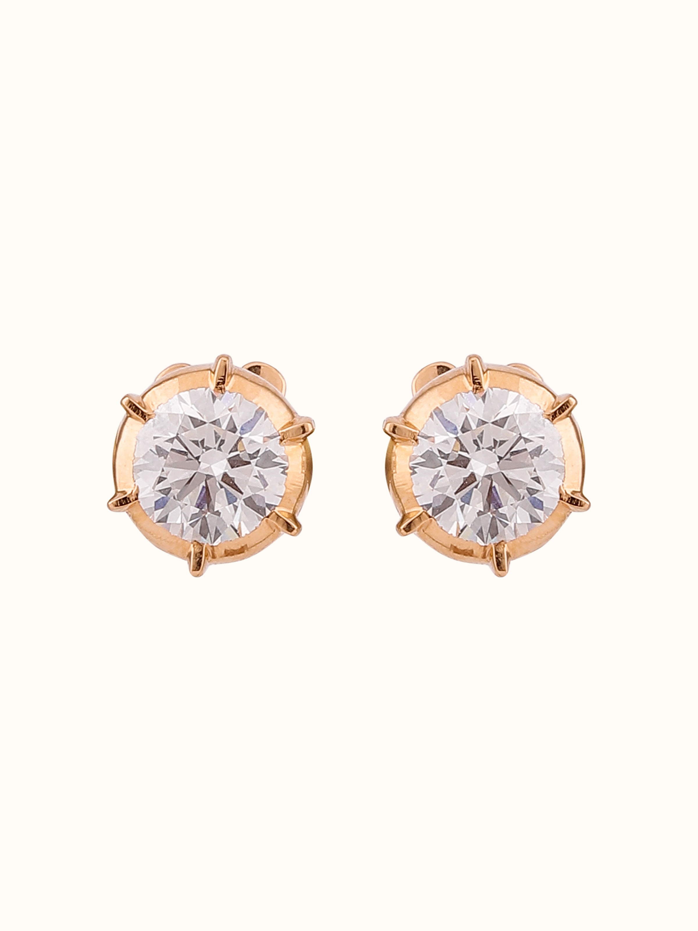 Front view of close-setting 22 Karat gold studs with bright polished finish