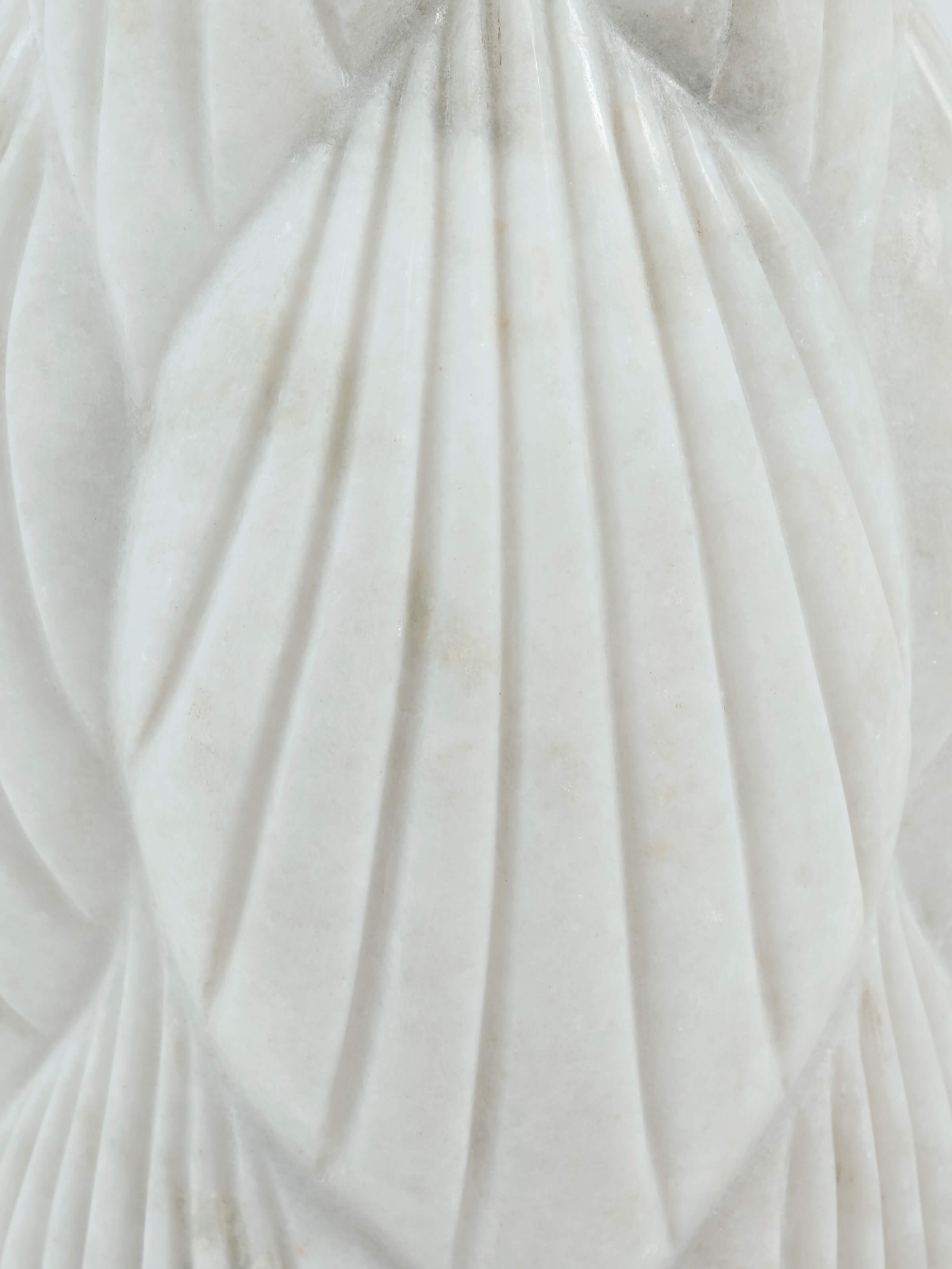 Detail view of marble floor vase carving patterns