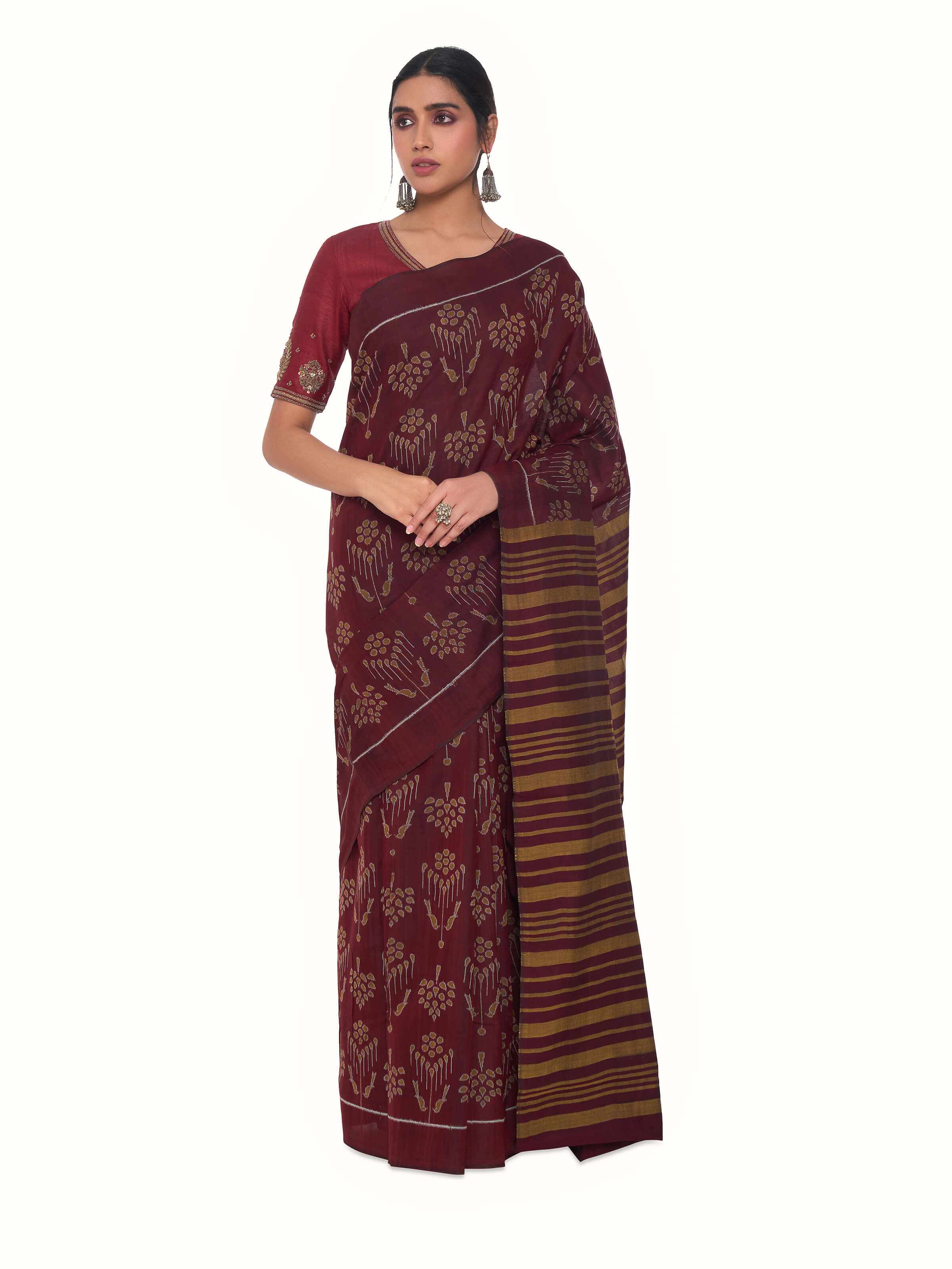Front view of brown cotton Odisha ikat bandha saree with traditional woven motifs