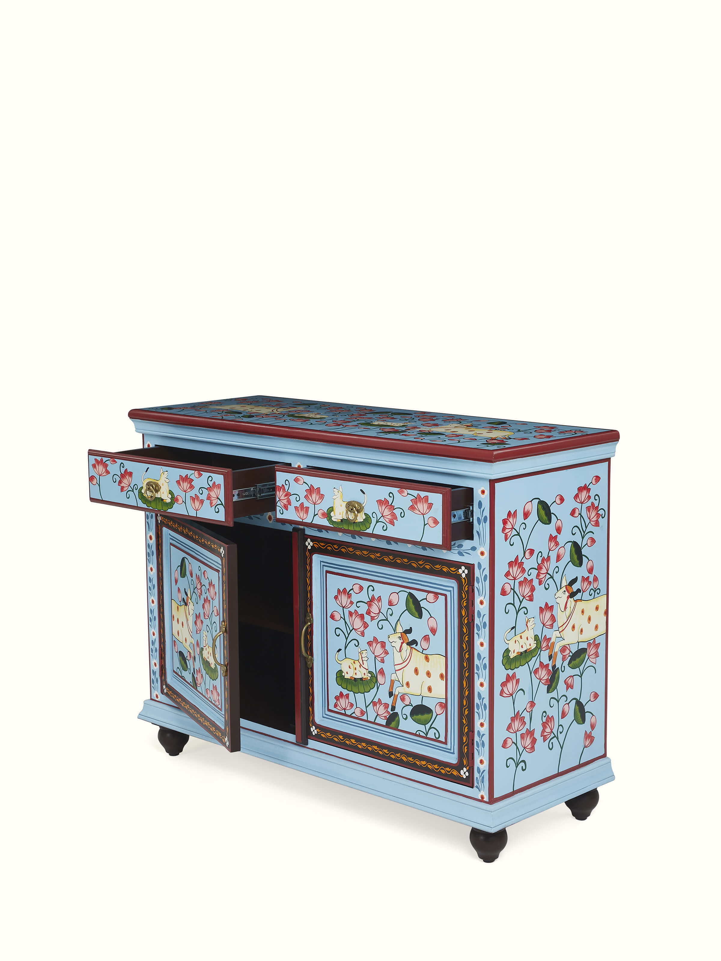 Close-up of drawer fronts with intricate hand-carved designs – luxury Indian home accent