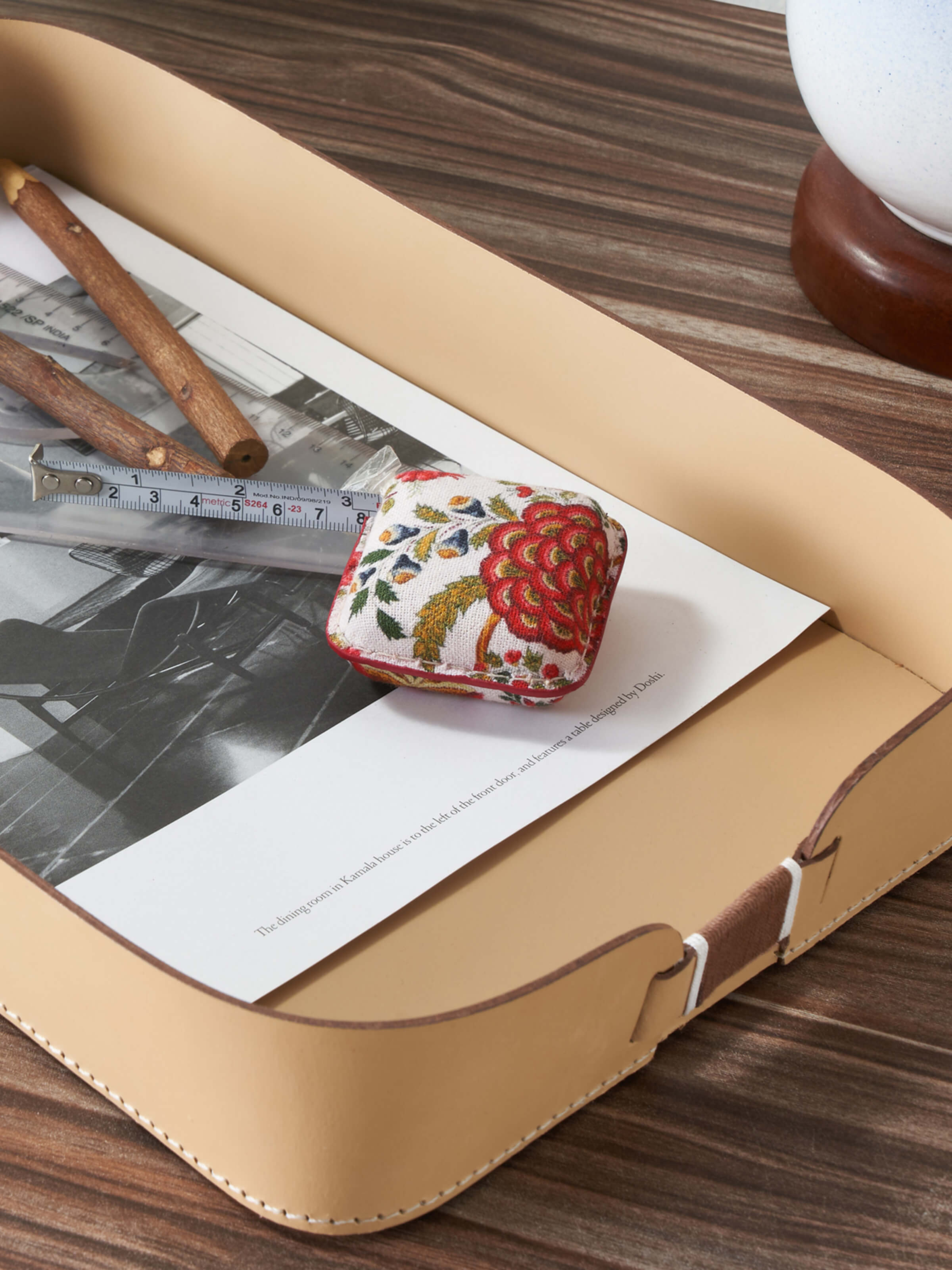 Side view of Leather Measuring Tape in Red color displaying its compact design