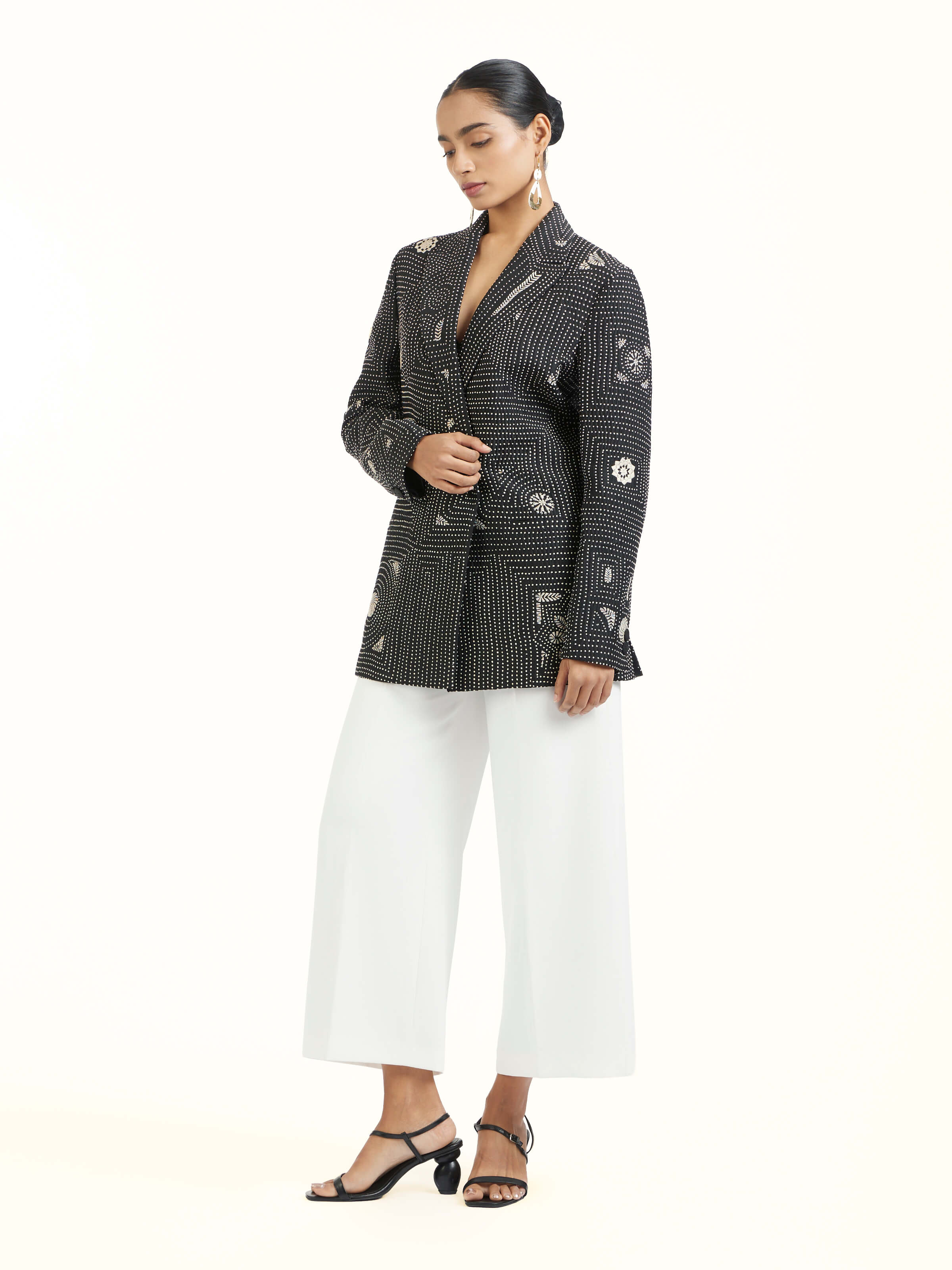 Side view of black silk kantha jacket showcasing tailored fit