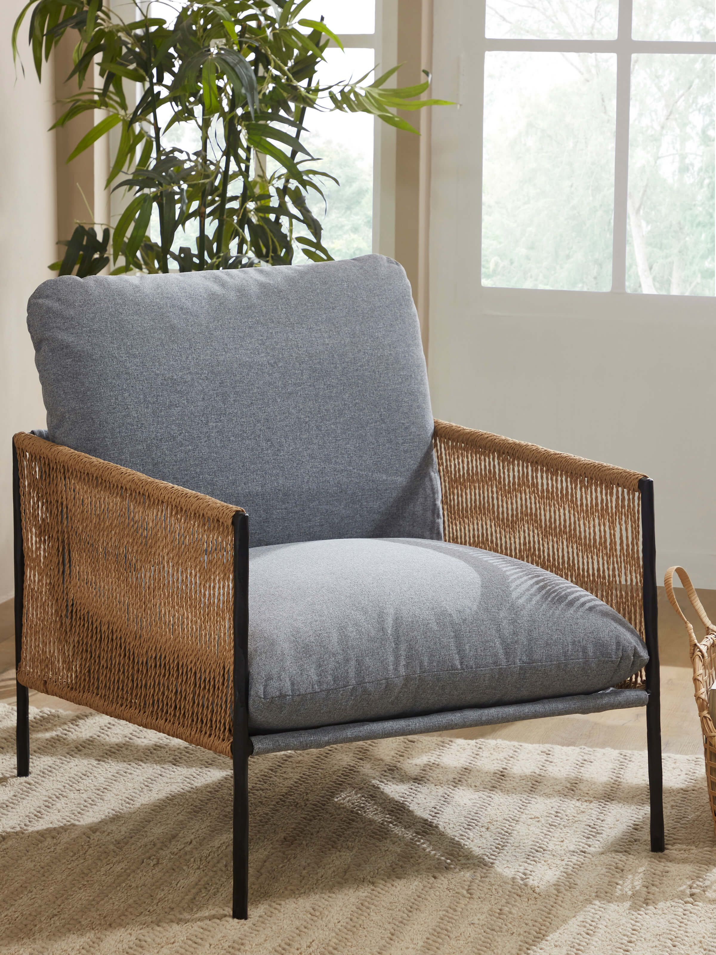 Side view of Upholstered Metal Paper Cord Weave Armchair showcasing the ergonomic design and stylish paper cord weave.