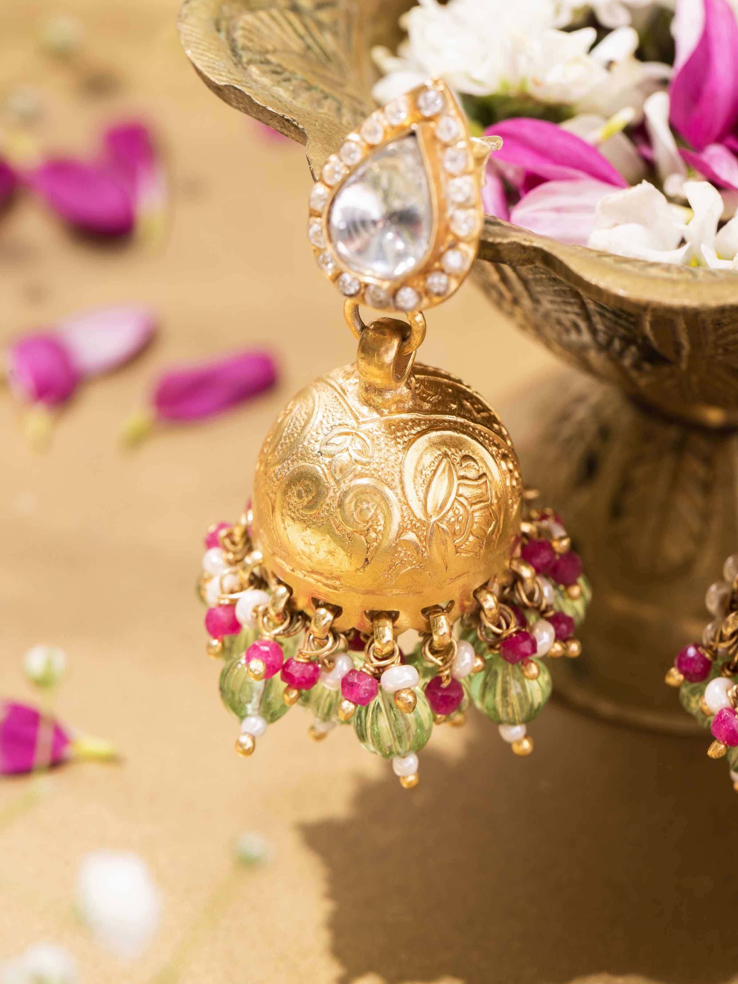 Detailed shot highlighting texture and finish of silver jhumka earrings