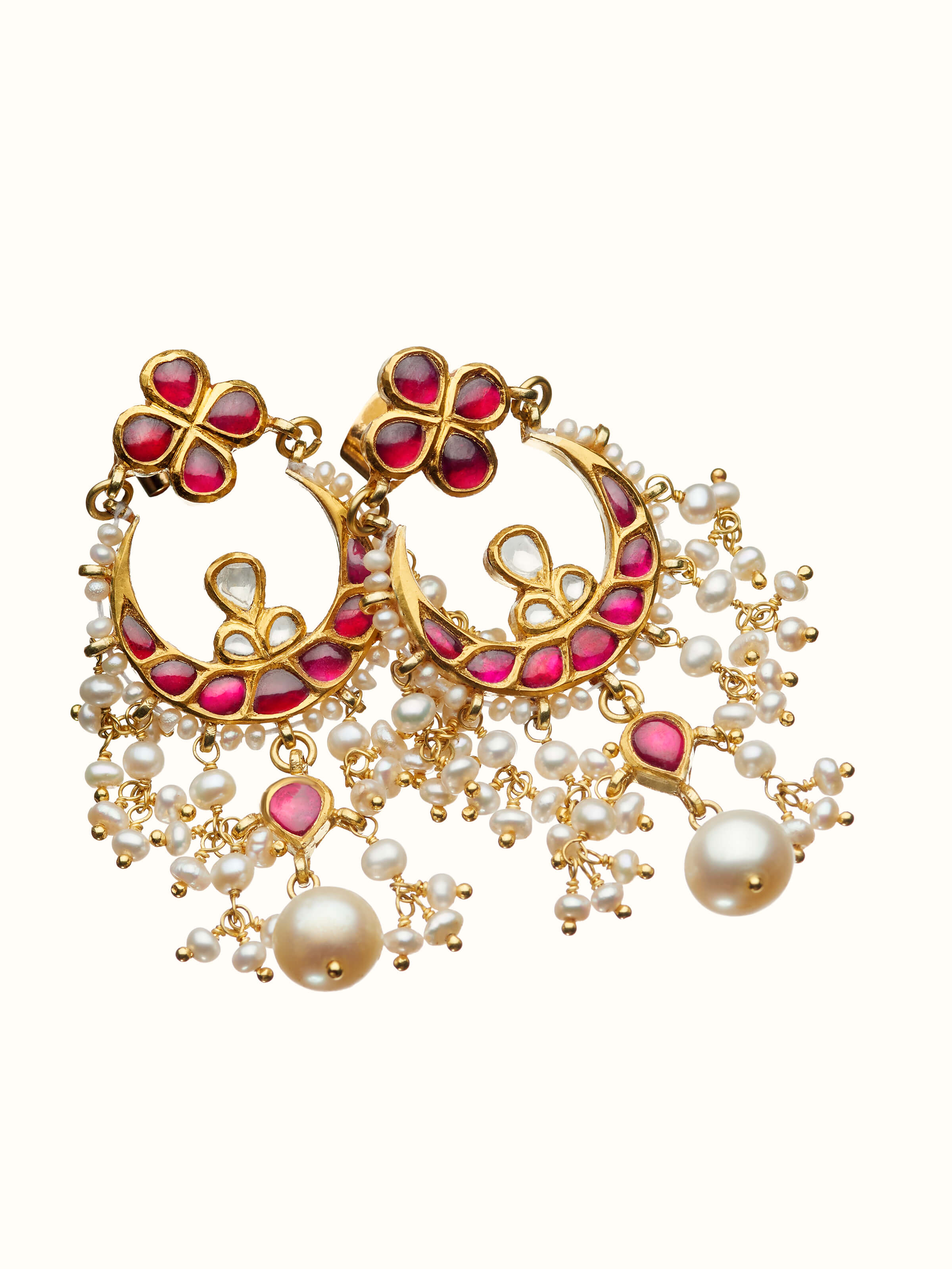 angled view of jadau 18 karat gold drops