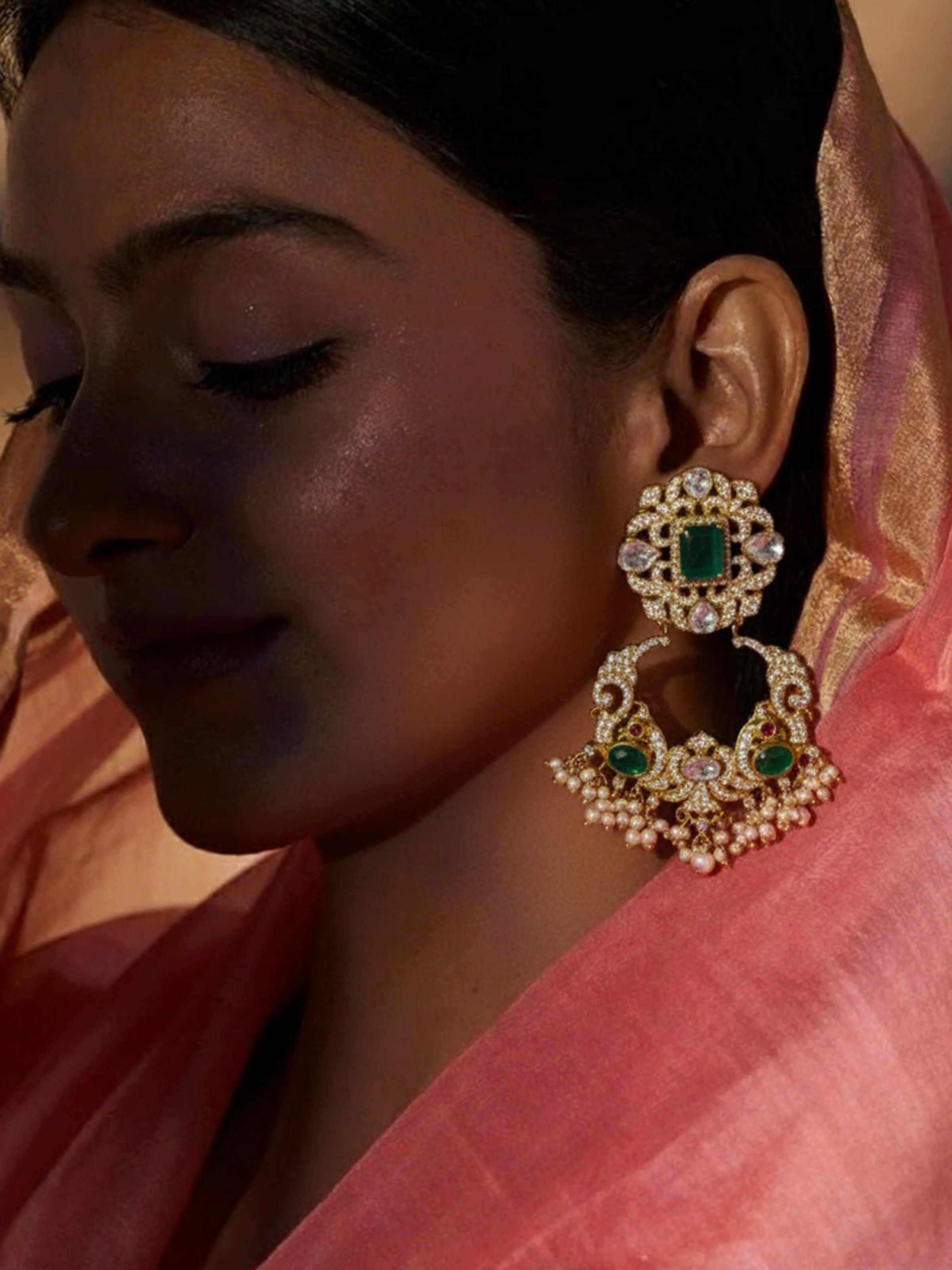 Silver smithing drop earrings worn on ears