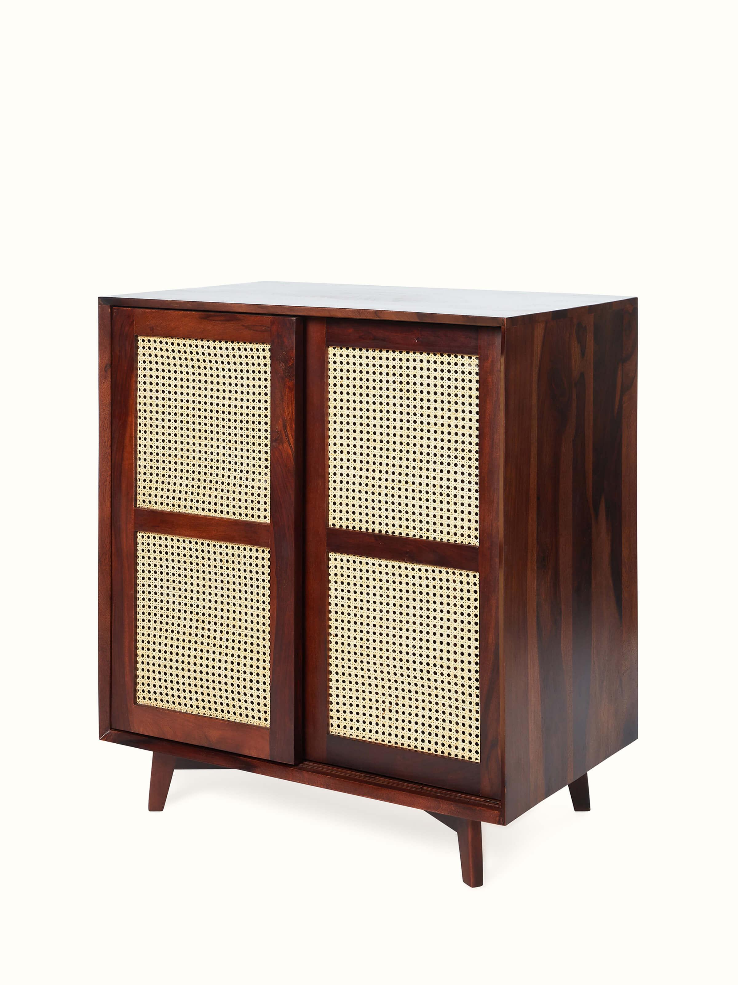Close-up of the Sheesham wood and cane bar cabinet, highlighting the intricate cane work and wood finish.