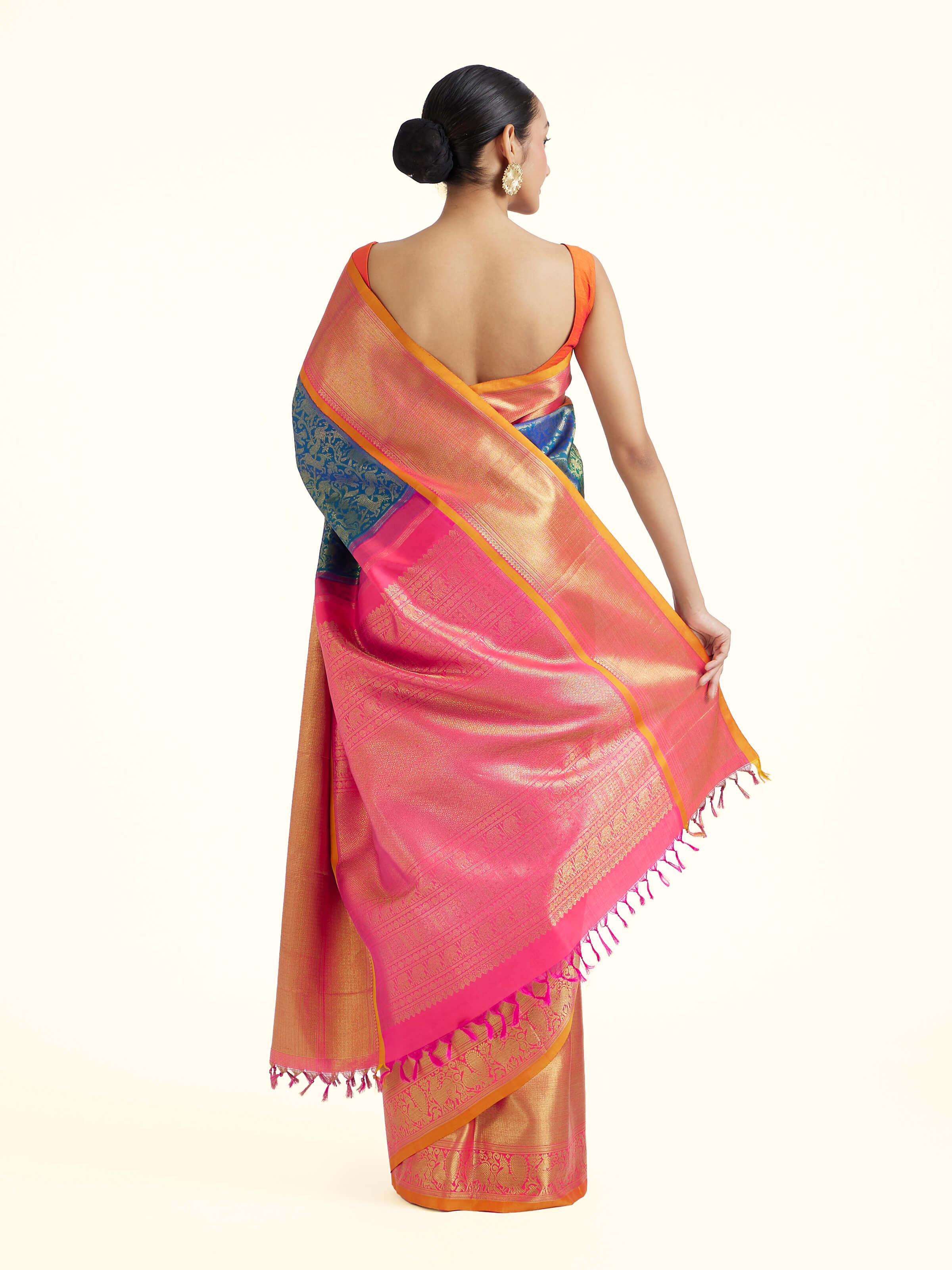 Back view of blue silk Kancheepuram saree displaying ornate pallu design
