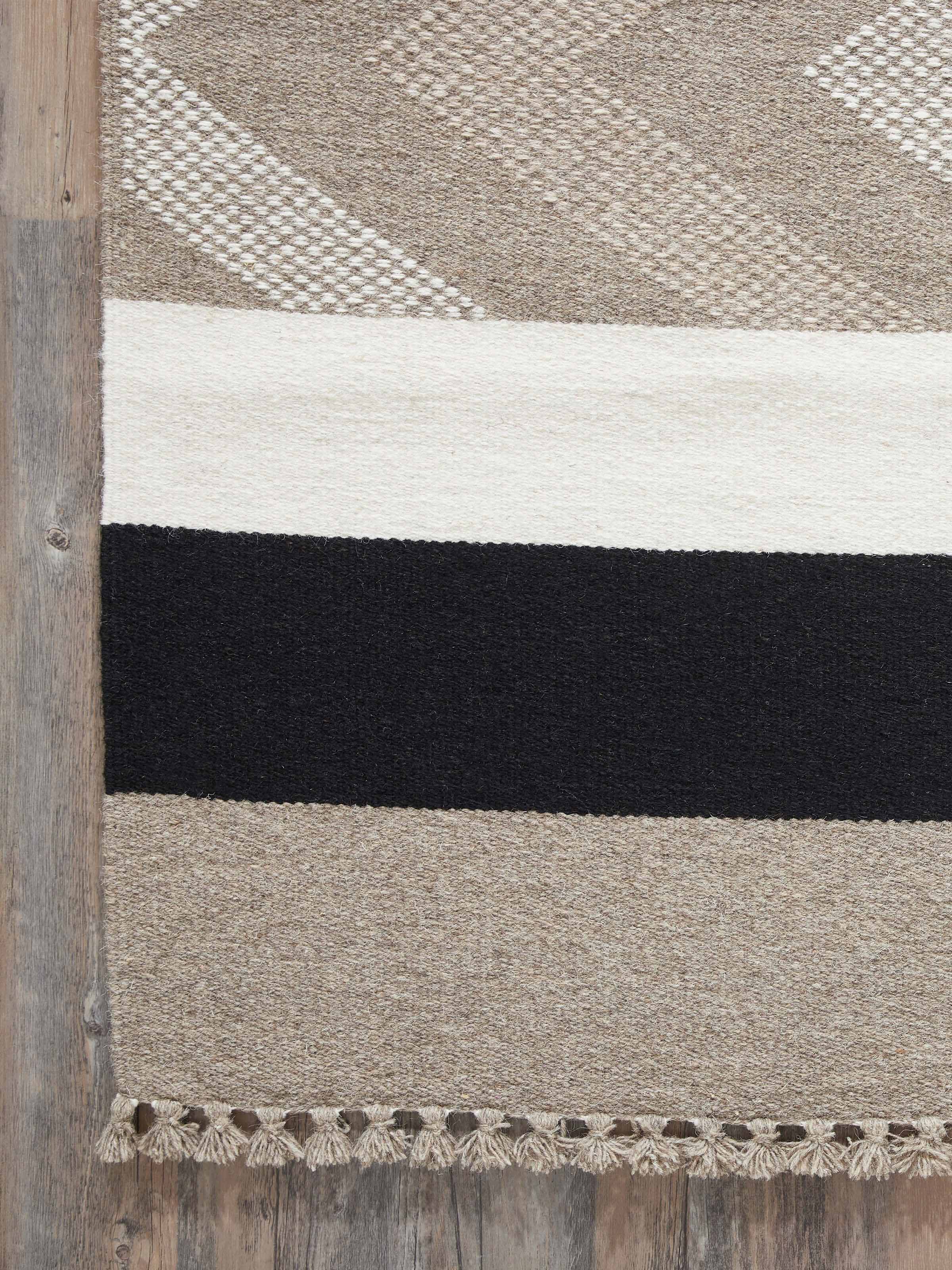 Detailed view of Textured Chevron Grey Melange Jawaja wool & cotton handloom dhurrie (4x6 ft), focusing on the texture and material.