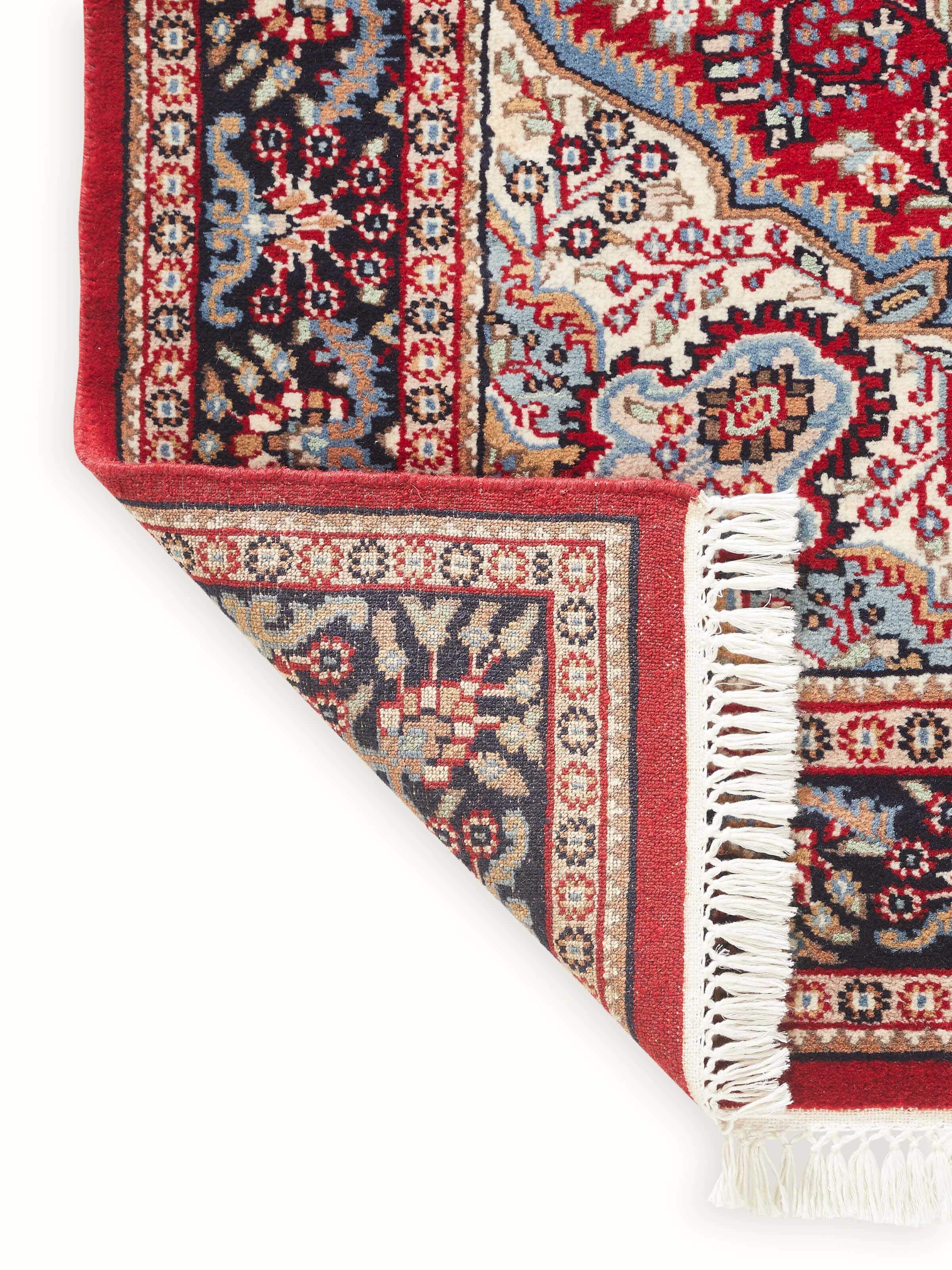 Back view of Persian red Gwalior carpet with hand-knotted craftsmanship