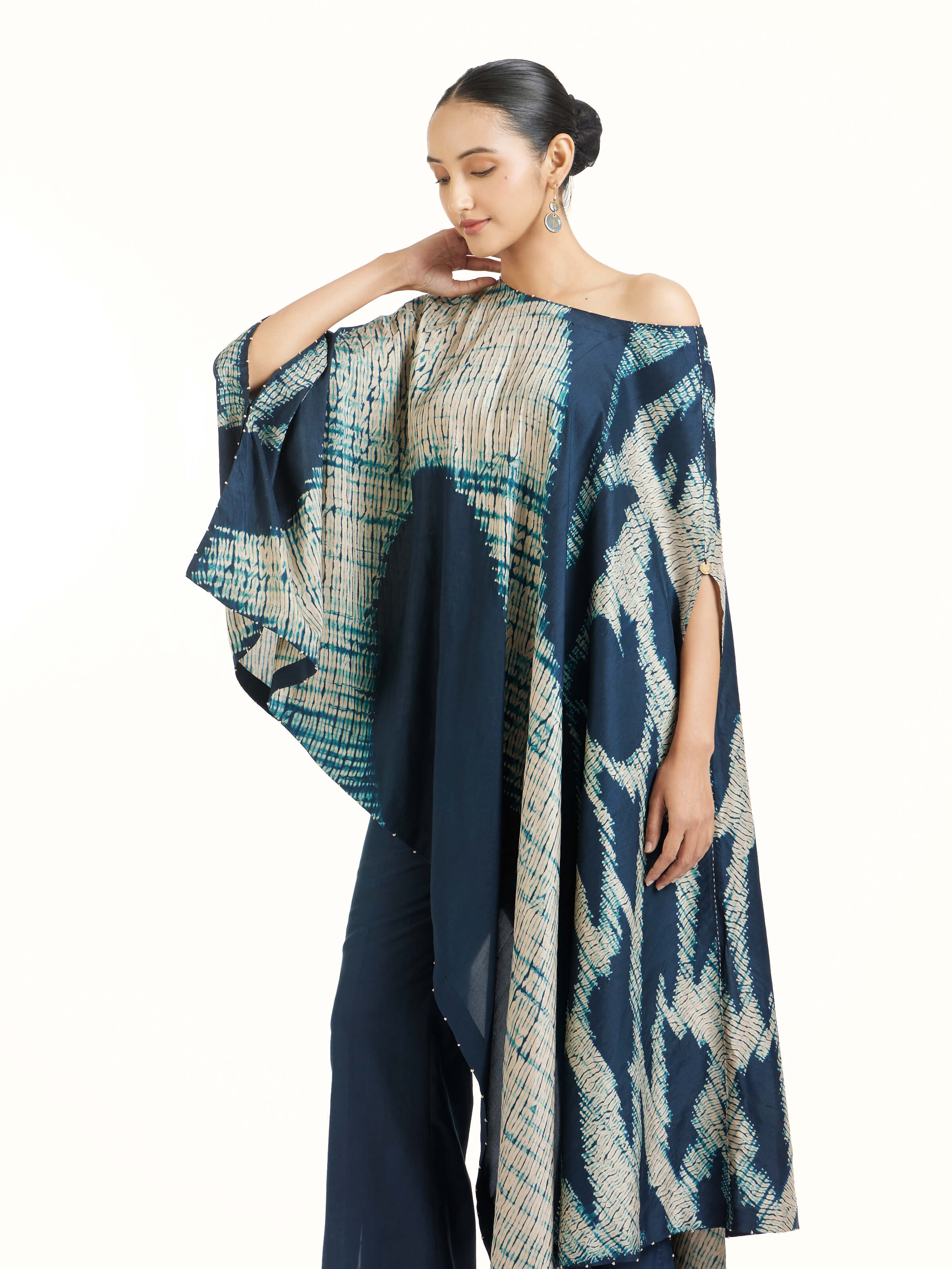 Angled view of blue silk Shibori co-ord set highlighting Shibori technique