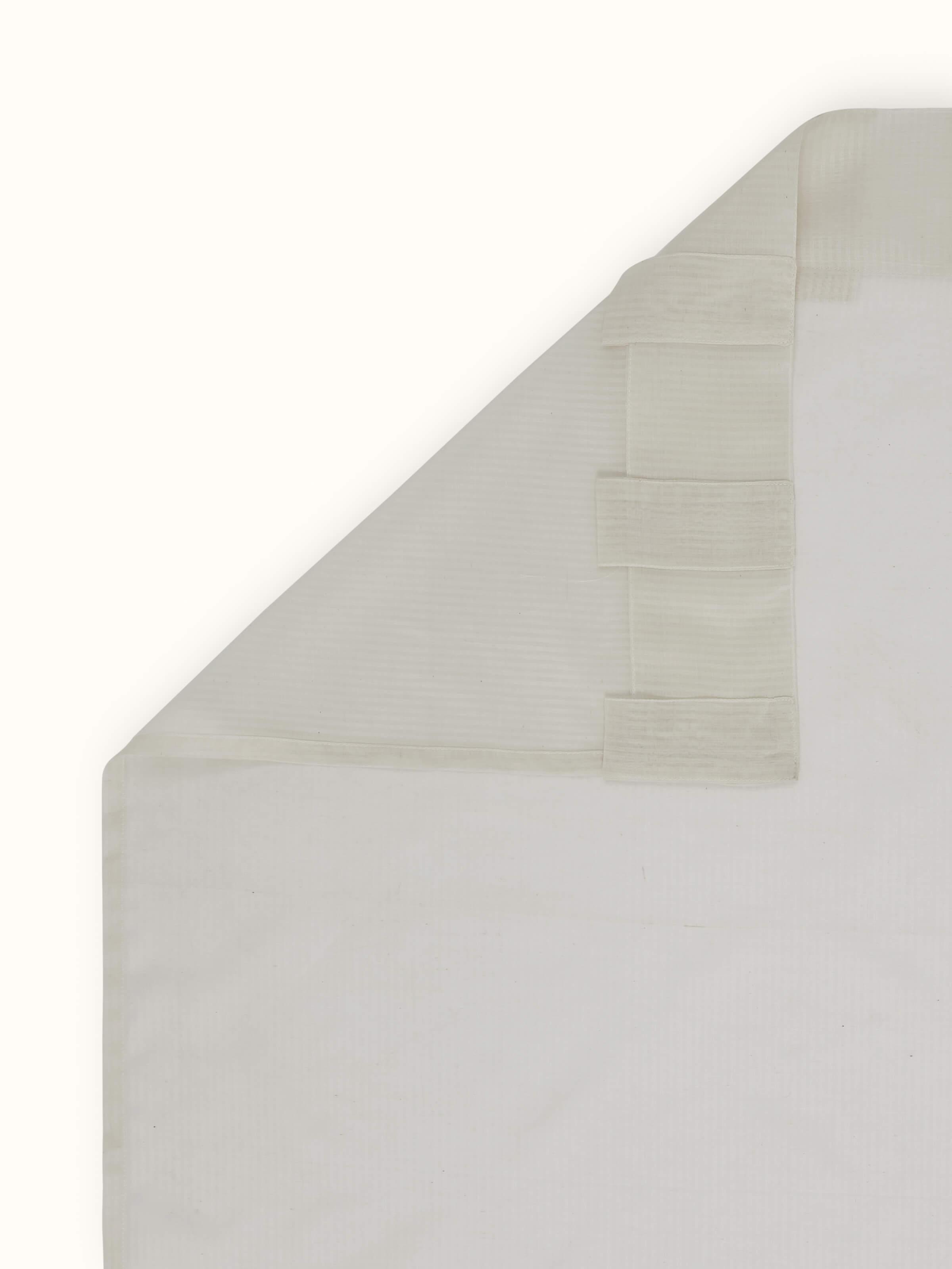 Back view illustrating curtain's delicate weave and subtle design elements.