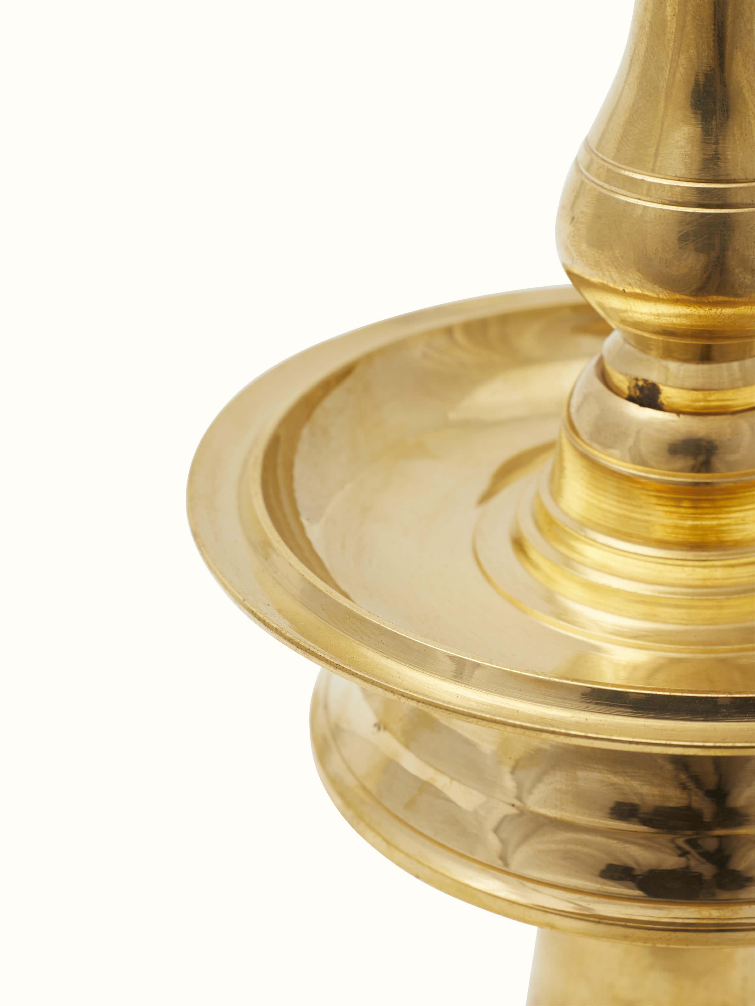 Top view of traditional brass samai vilakku stand diya showing the refined craftsmanship and traditional elements