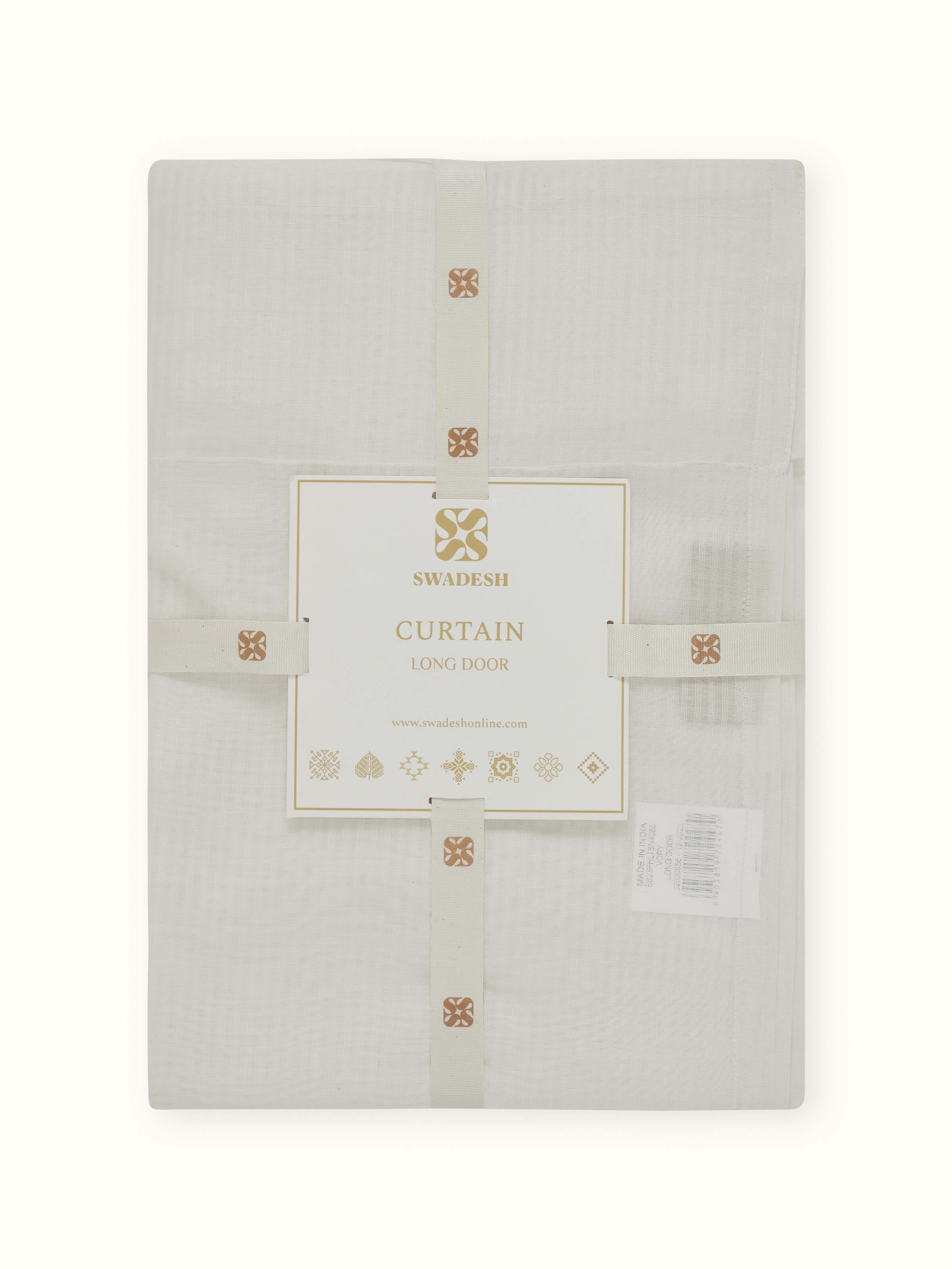 Side view of sheer ivory curtain – subtle buti detailing in handwoven fabric.