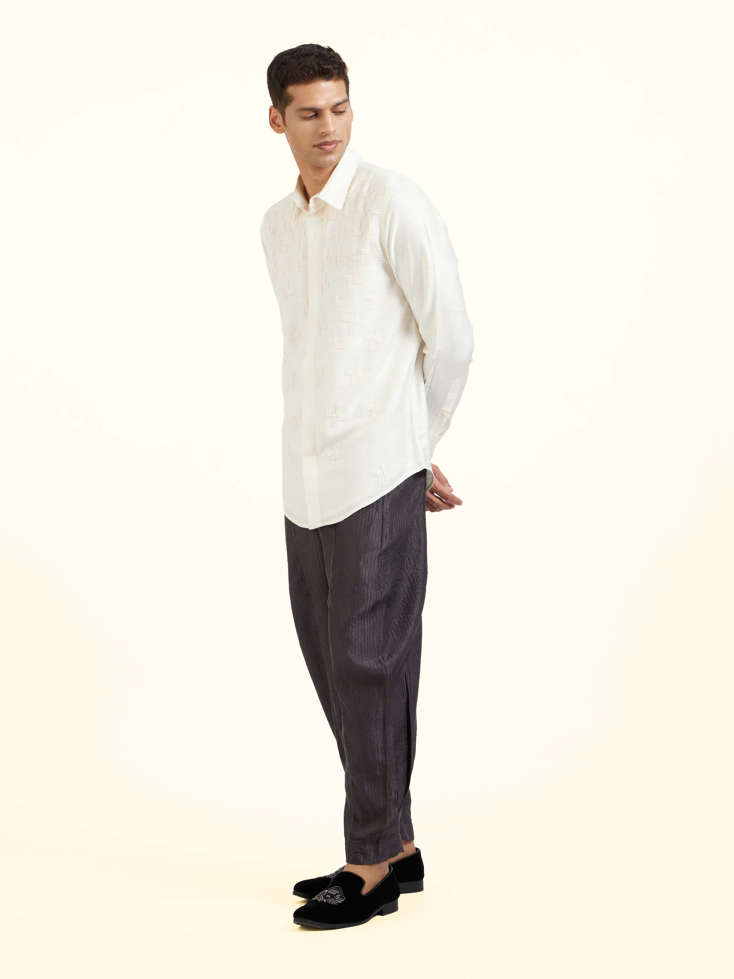 Side view of white hand embroidery shirt with clean structure and refined fit