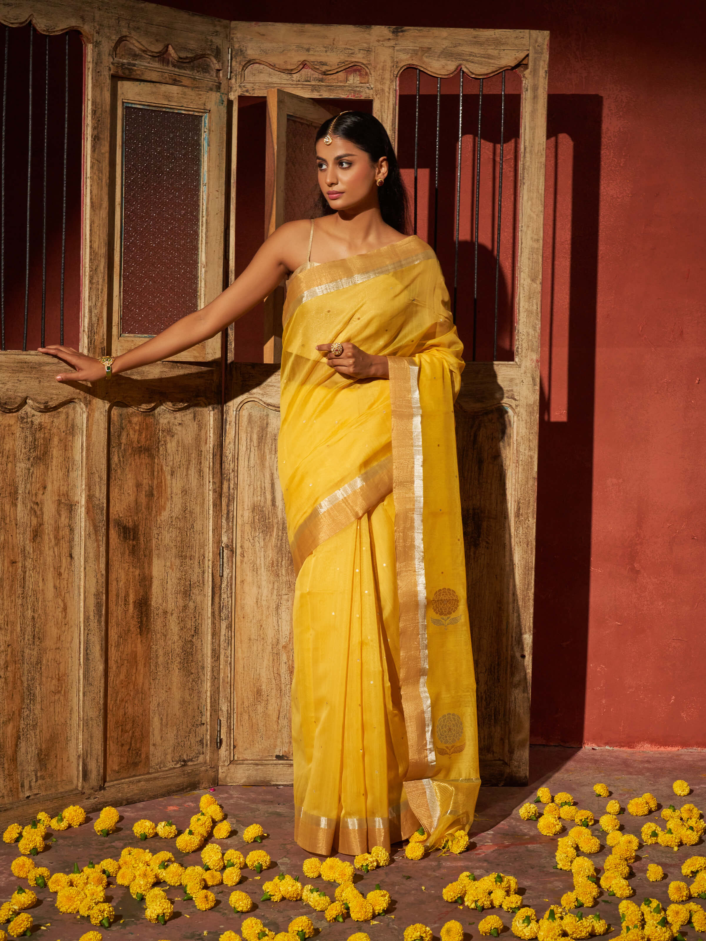 Side view of yellow mulberry silk cotton Chanderi saree showcasing light drape