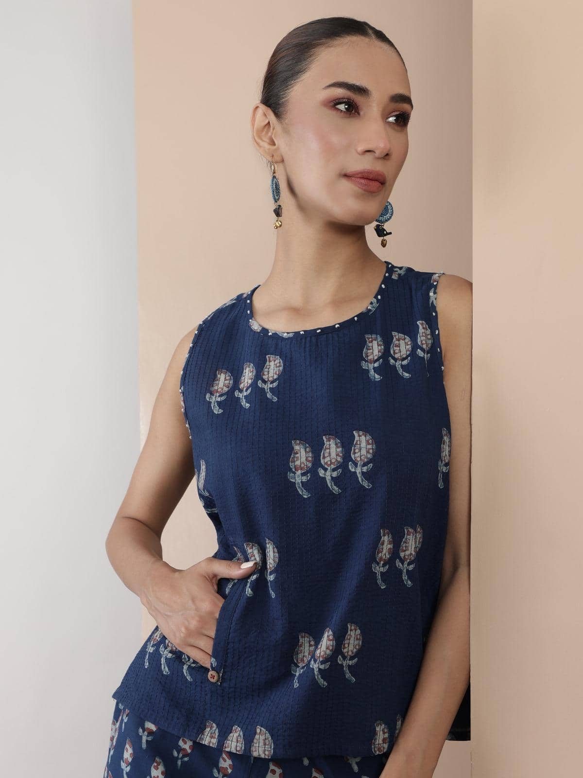 Full-length view of blue cotton pant with Dabu block prints, paired with a simple kurta.