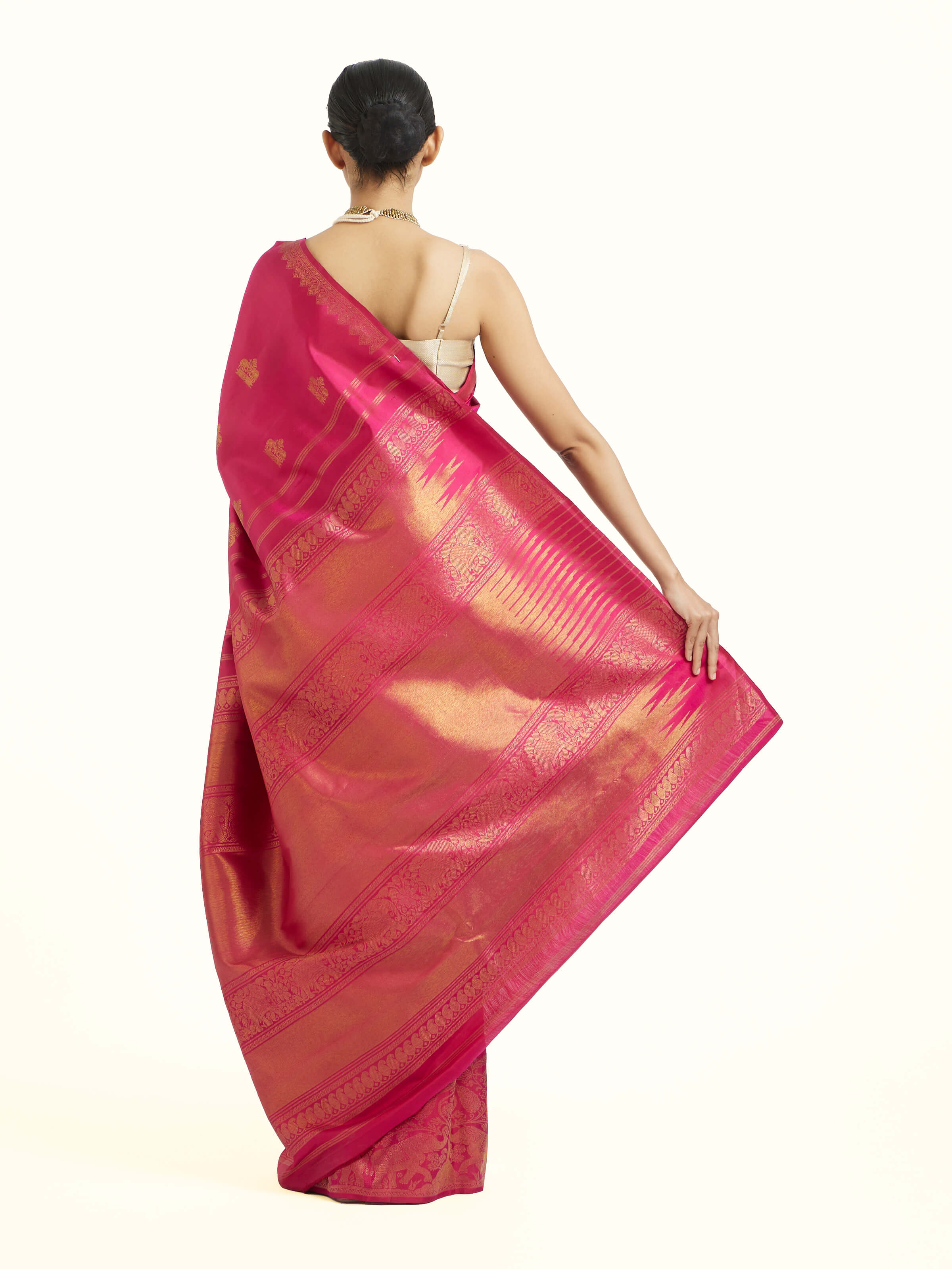 Back view of red silk Kancheepuram saree displaying complete ensemble