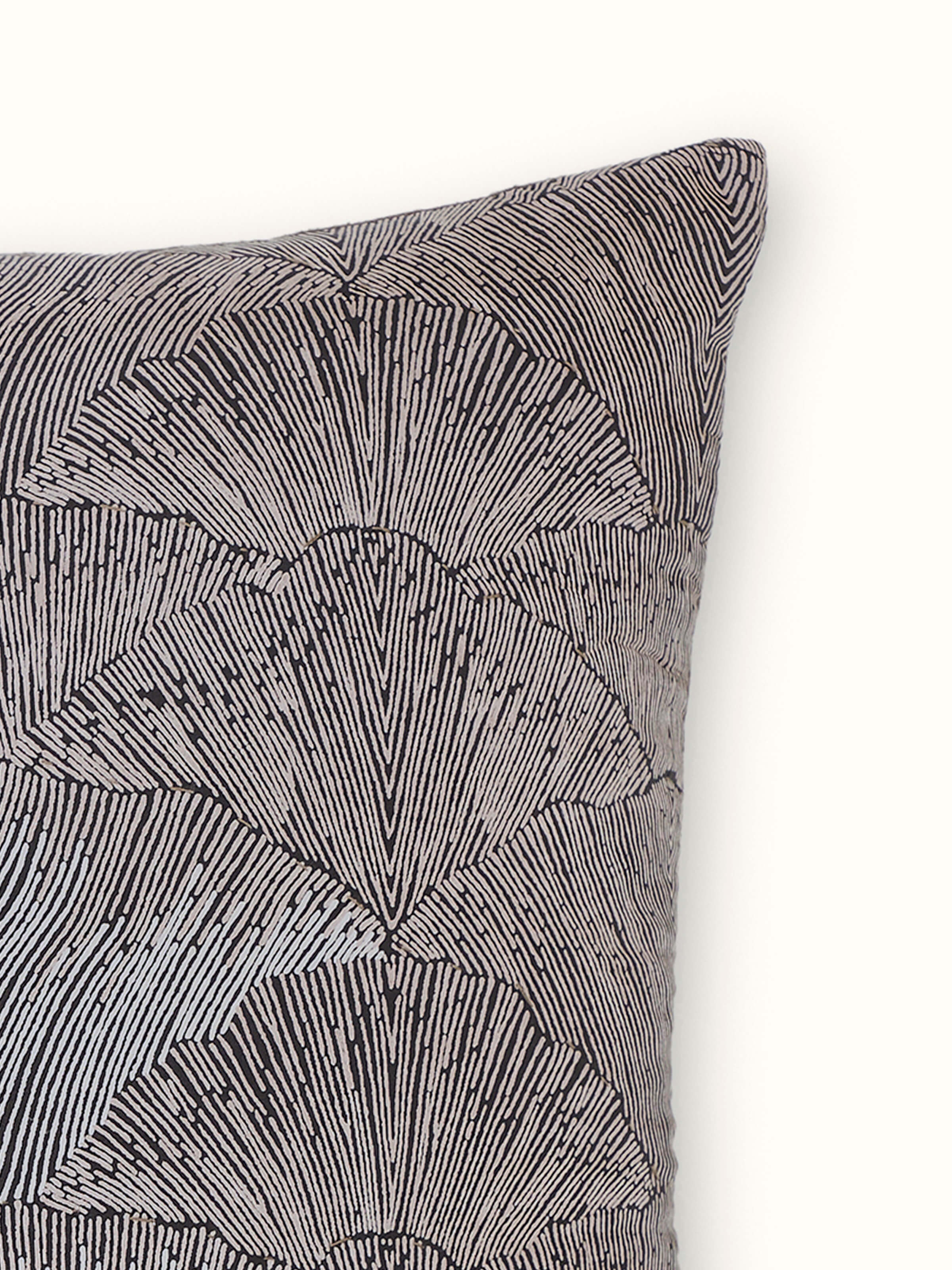 Detail shot of Parvat brown silk Sanganeri cushion cover showcasing intricate hand block printed floral motifs.