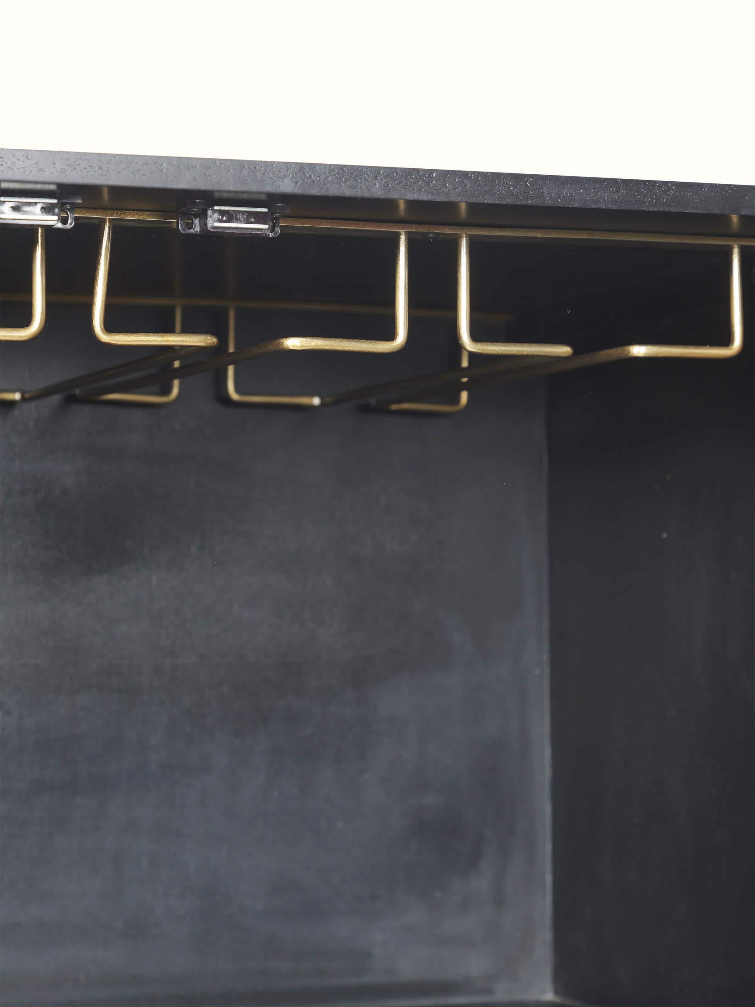 Detailed view of the cabinet doors featuring mother-of-pearl inlay on the mango wood bar cabinet, highlighting the intricate design