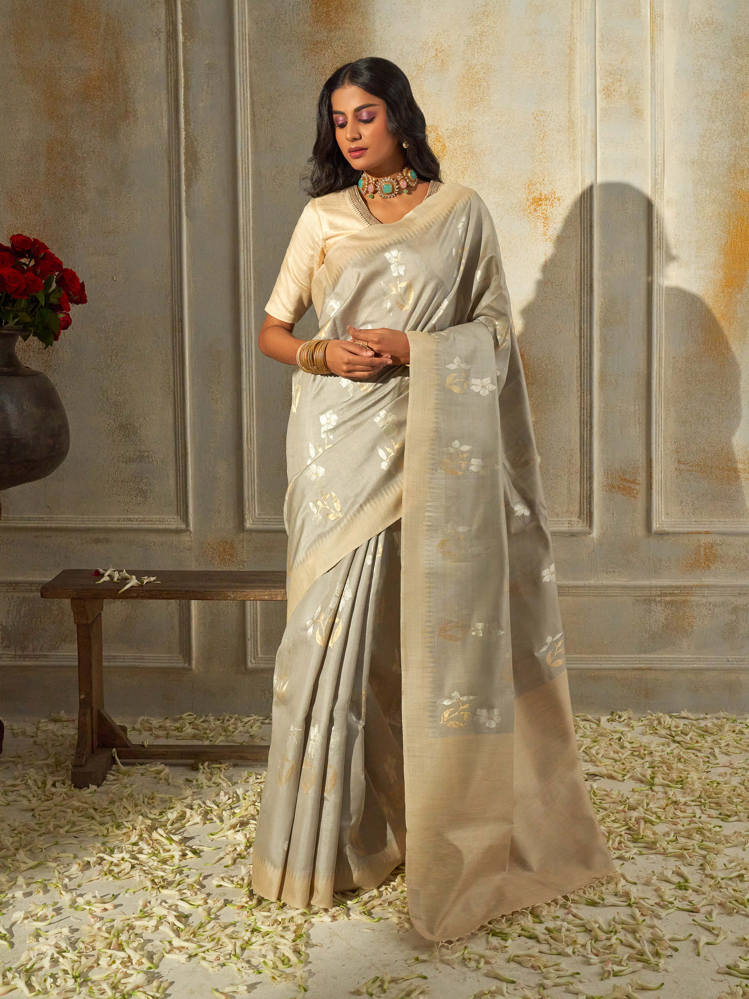 Side view of ecru tussar silk saree showcasing airy drape