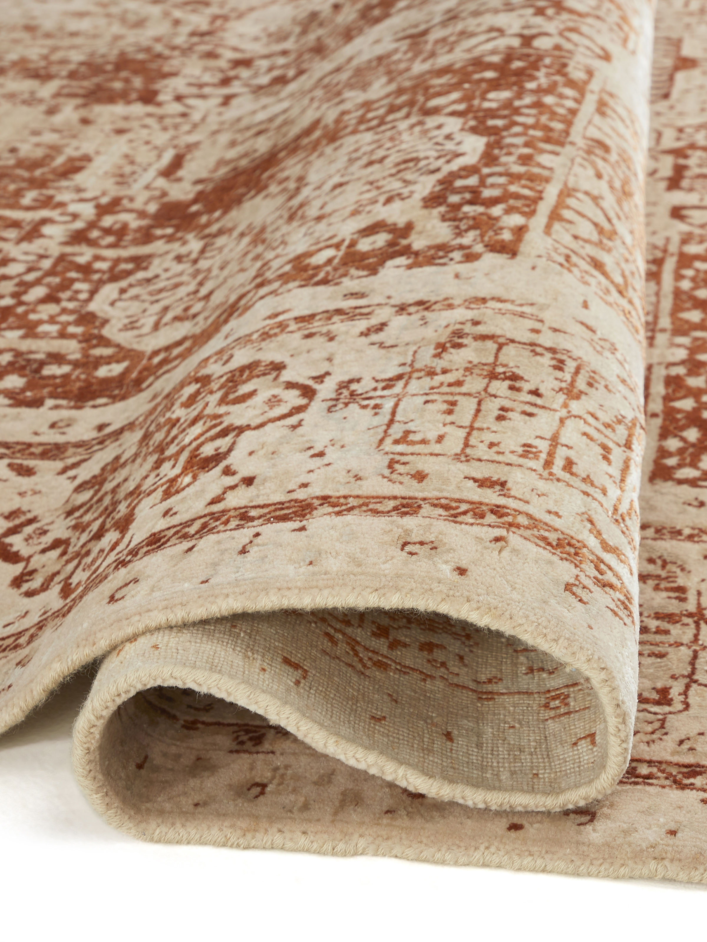 Close-up view of Distressed Mamluk Beige Rust Bhadohi Wool & Viscose Hand-Knotted Rug highlighting the intricate knot details