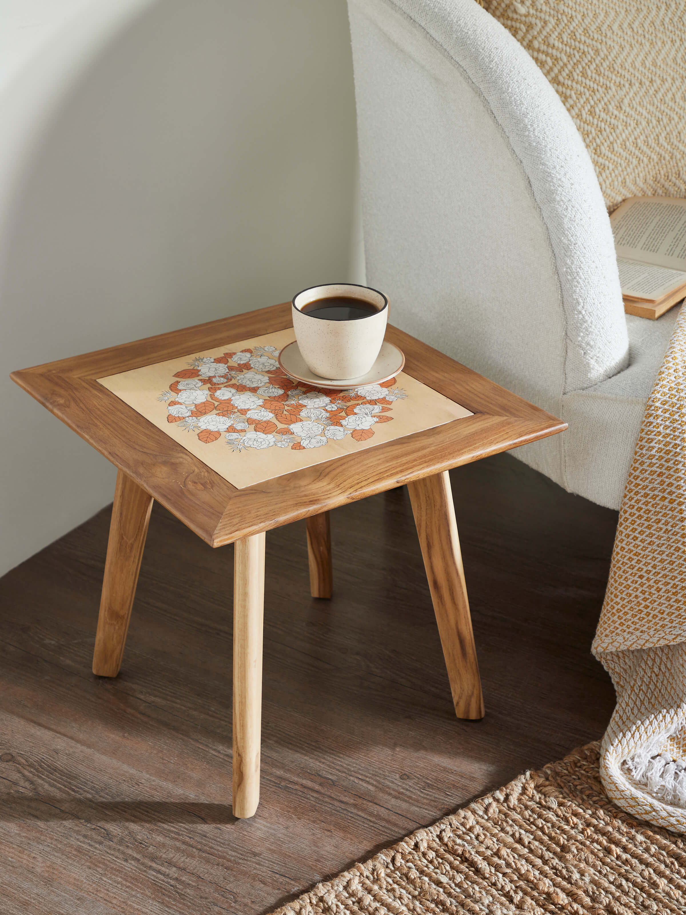 Side view of Teak wood pattachitra square side table, highlighting the intricate traditional design
