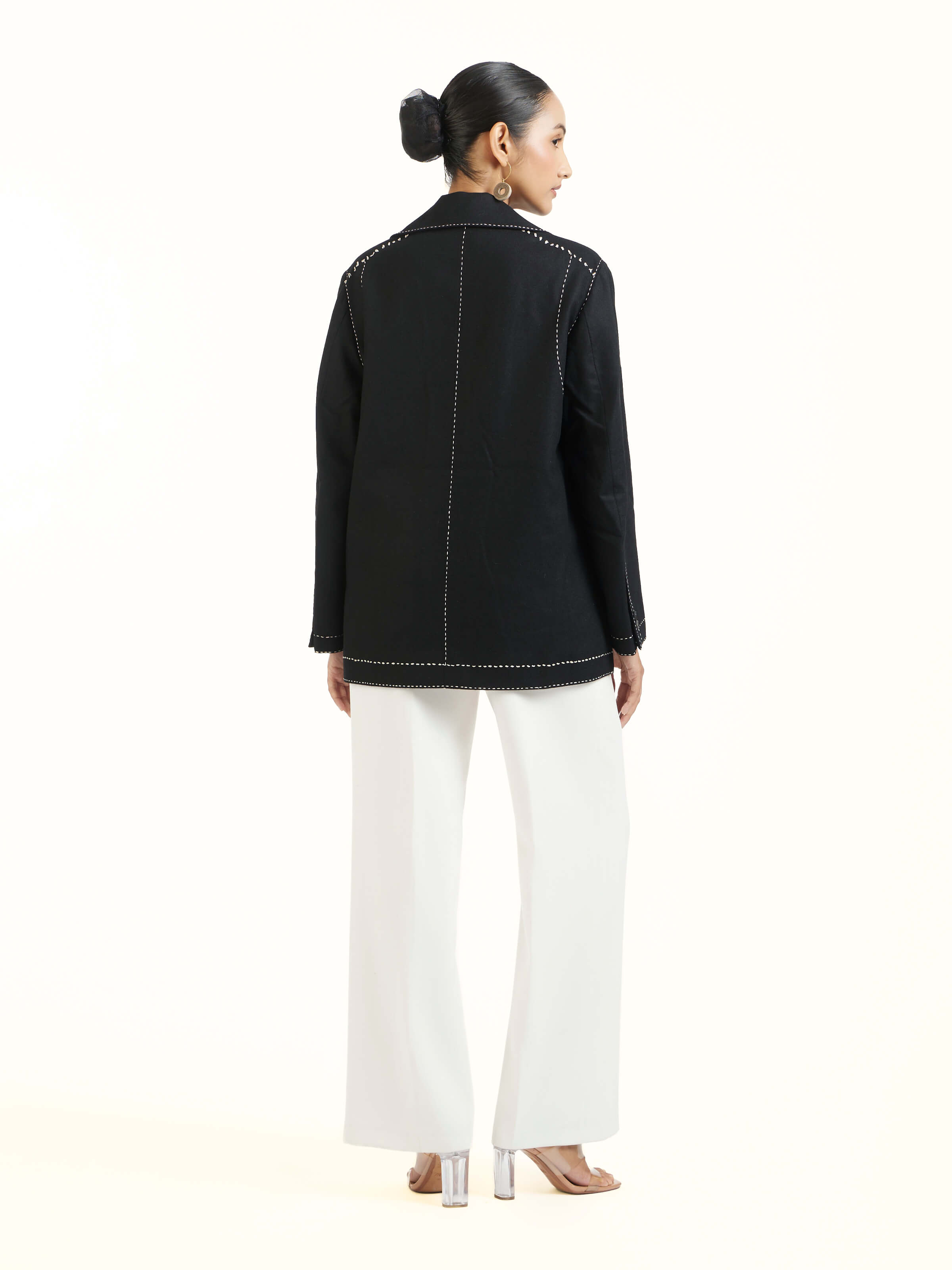 Back view of black wool kantha jacket with all-over kantha stitching pattern