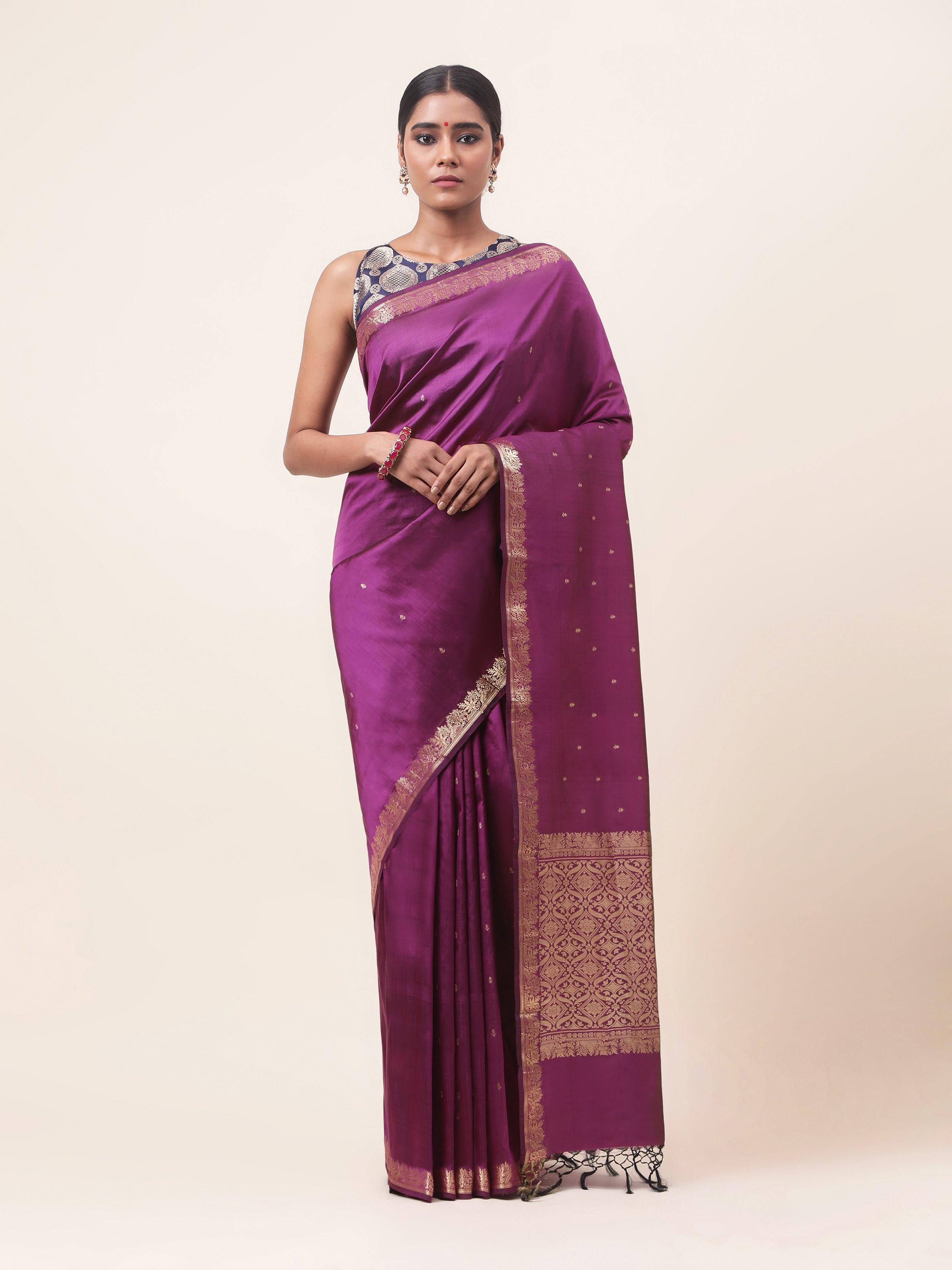 Front view of purple mulberry silk Banarasi saree with intricate zari motifs.