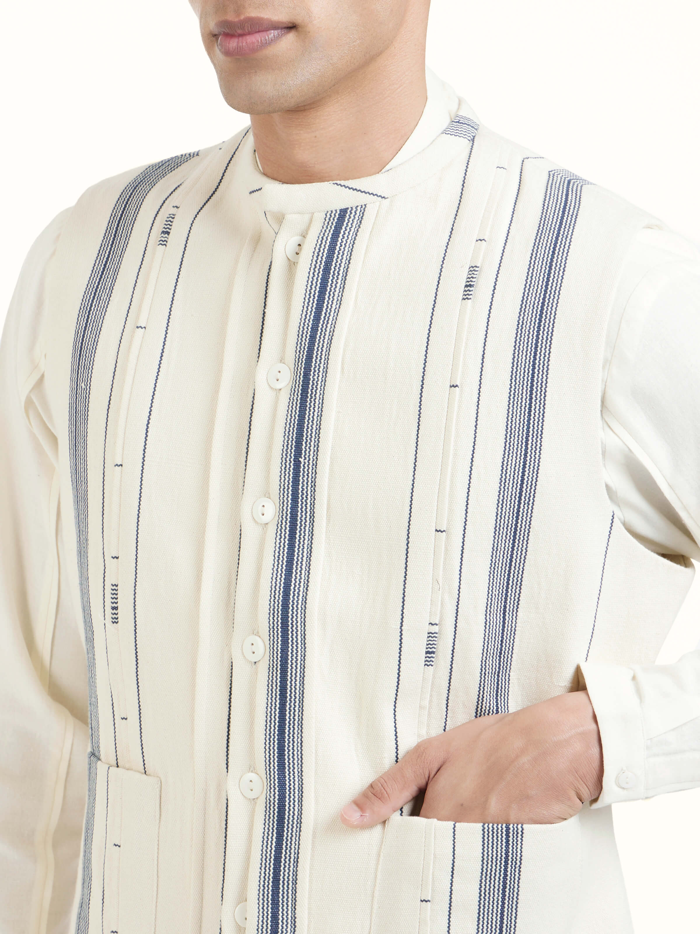 Detail view of ivory cotton handloom sleeveless jacket showcasing craftsmanship