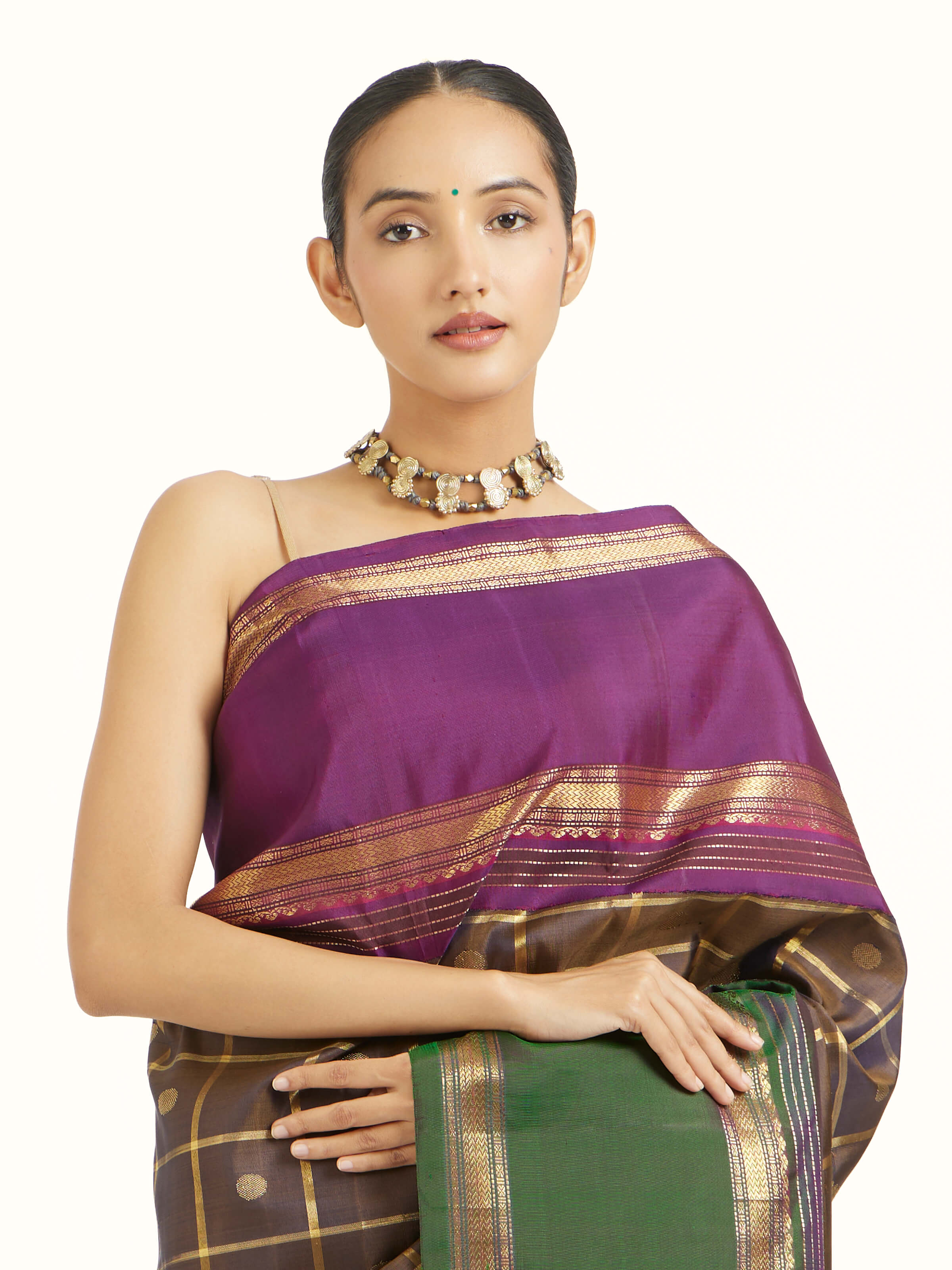 Angled view of black silk Kancheepuram saree showcasing traditional weave and sheen