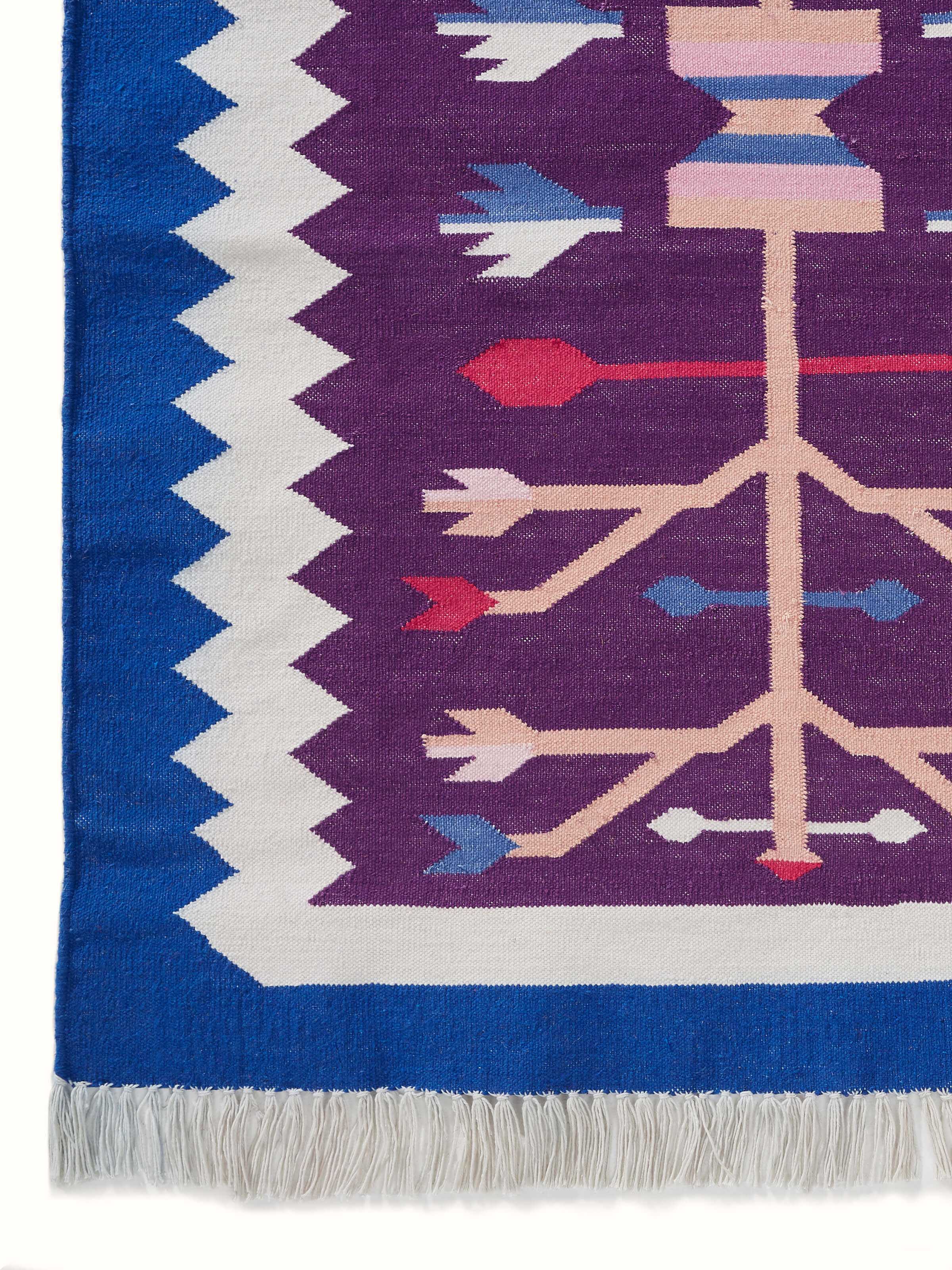 Side view displaying the thickness and handwoven quality of the dhurrie